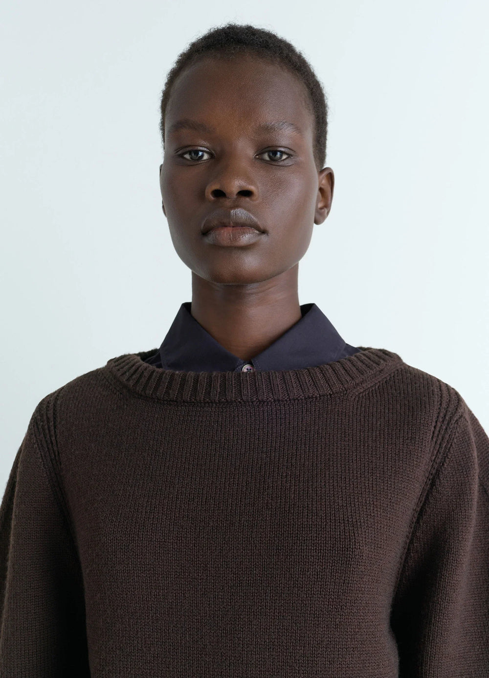 Sweater with Slits in Dark Brown Combed Wool, model shot, close-up view ribbed collar detail