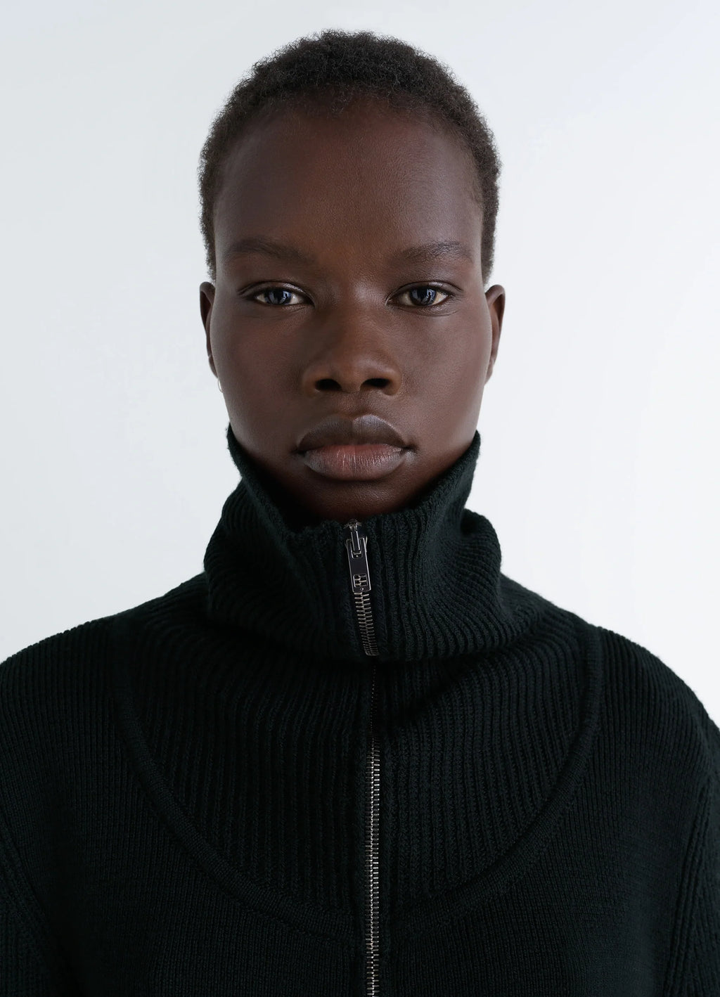 Zipped Sweater in Black Combed Wool, model shot, close-up view textured high collar