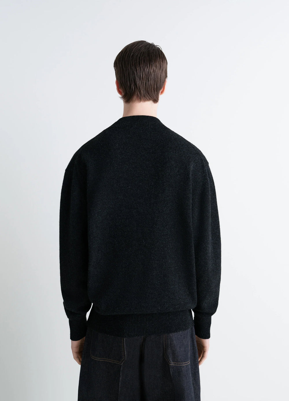 Mock Neck Sweater in Black Alpaca Yak Wool, model shot, back view straight hem over jeans