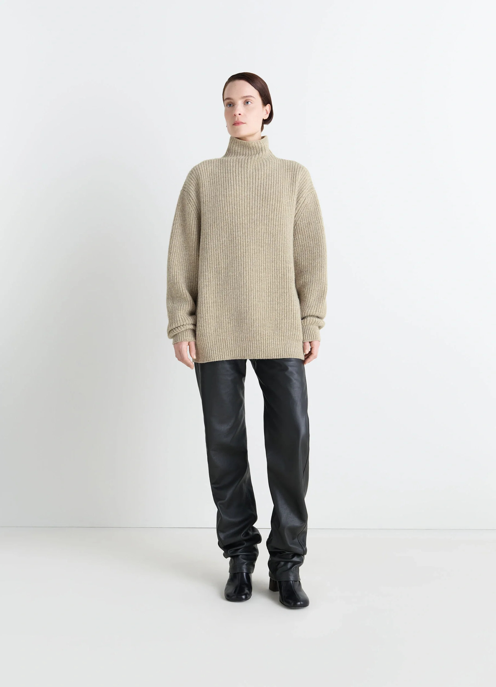 High neck sweater in alpaca yak wool blend, model shot, three-quarter view oversized fit drop shoulder