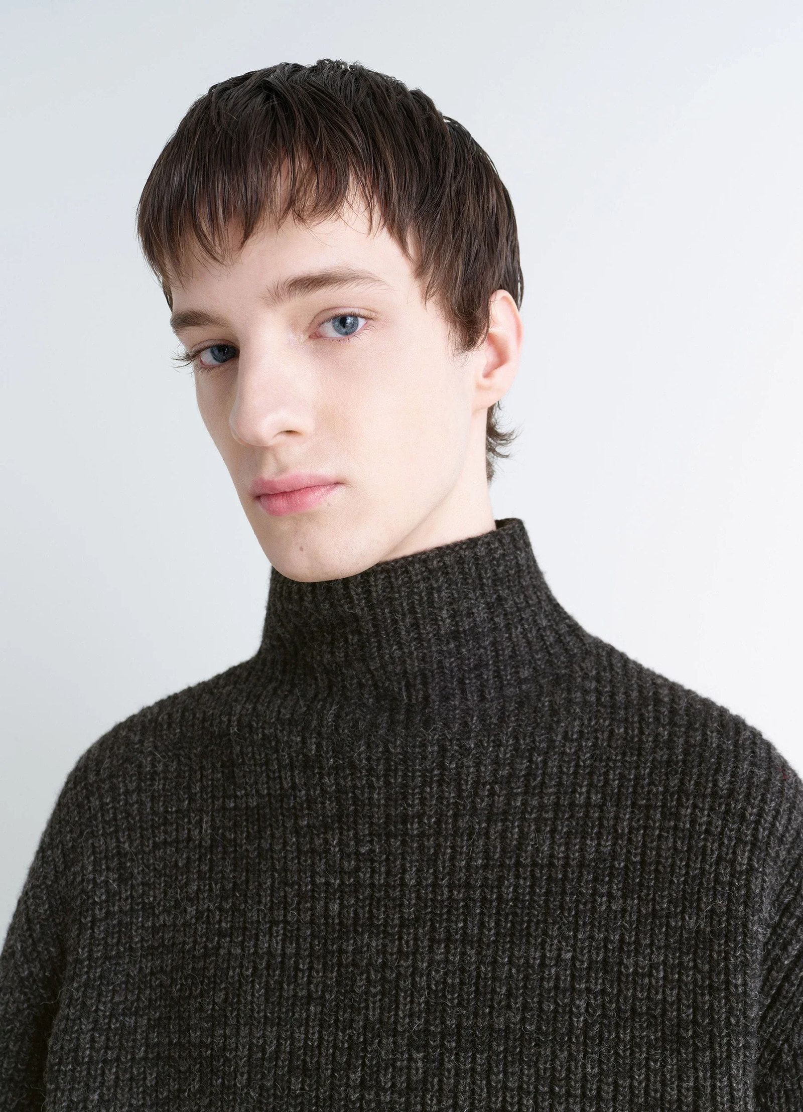 High neck sweater in densely ribbed alpaca yak, model shot, close-up portrait high neck detail