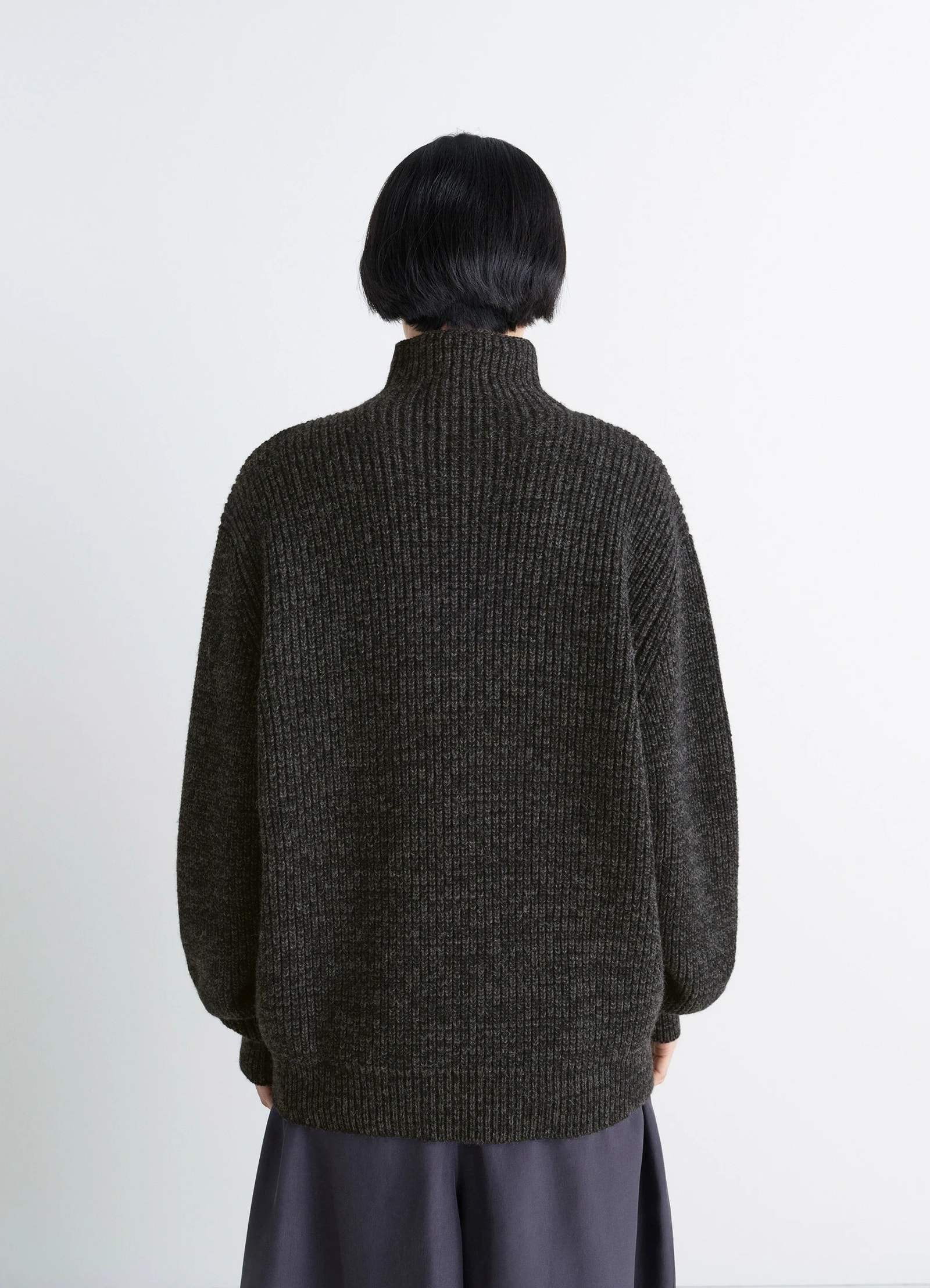 High neck sweater in densely ribbed alpaca yak, model shot, back view dropped shoulders