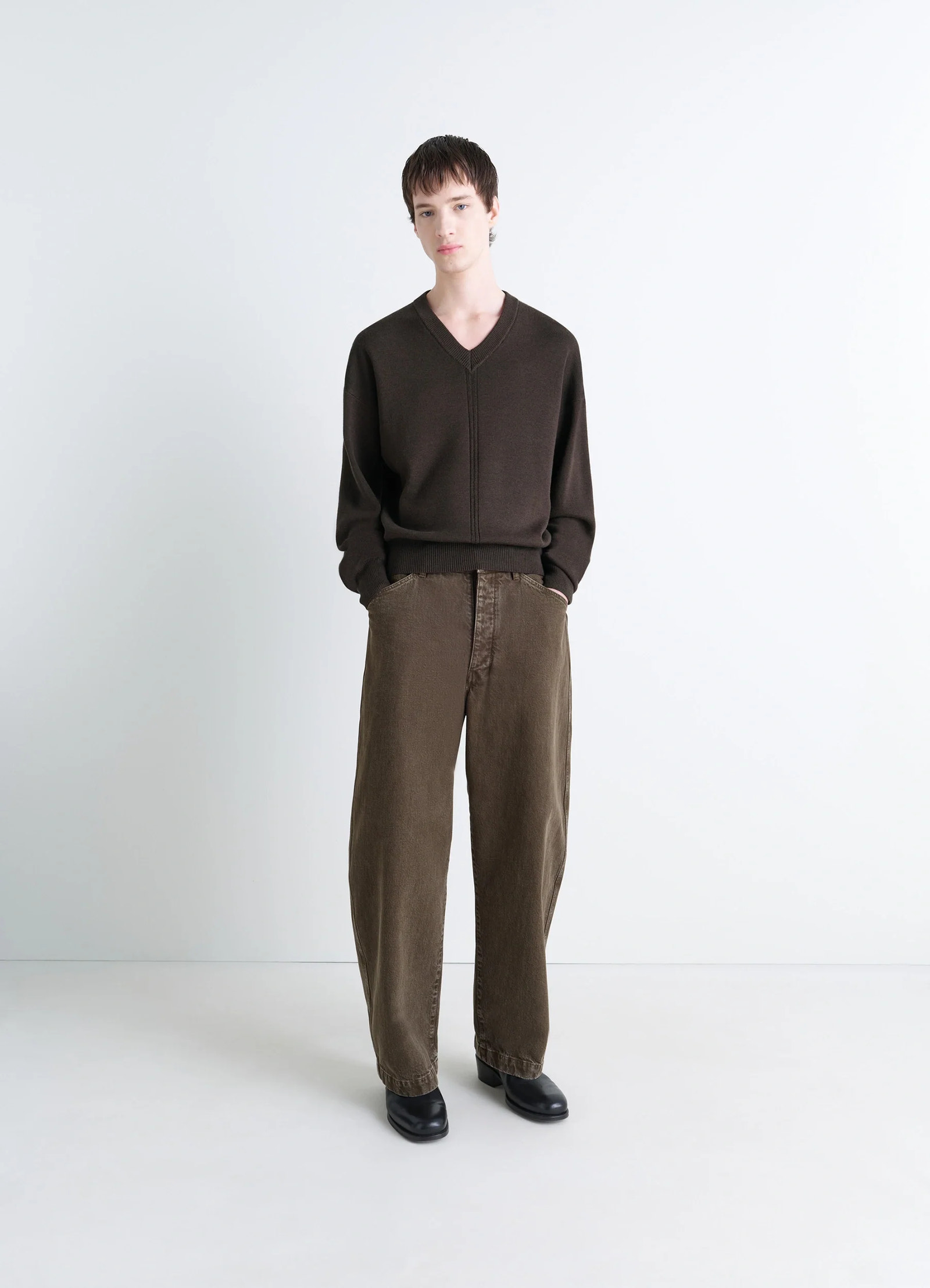 Lemaire v neck sweater in blended merino wool, model shot, three-quarter view relaxed fit