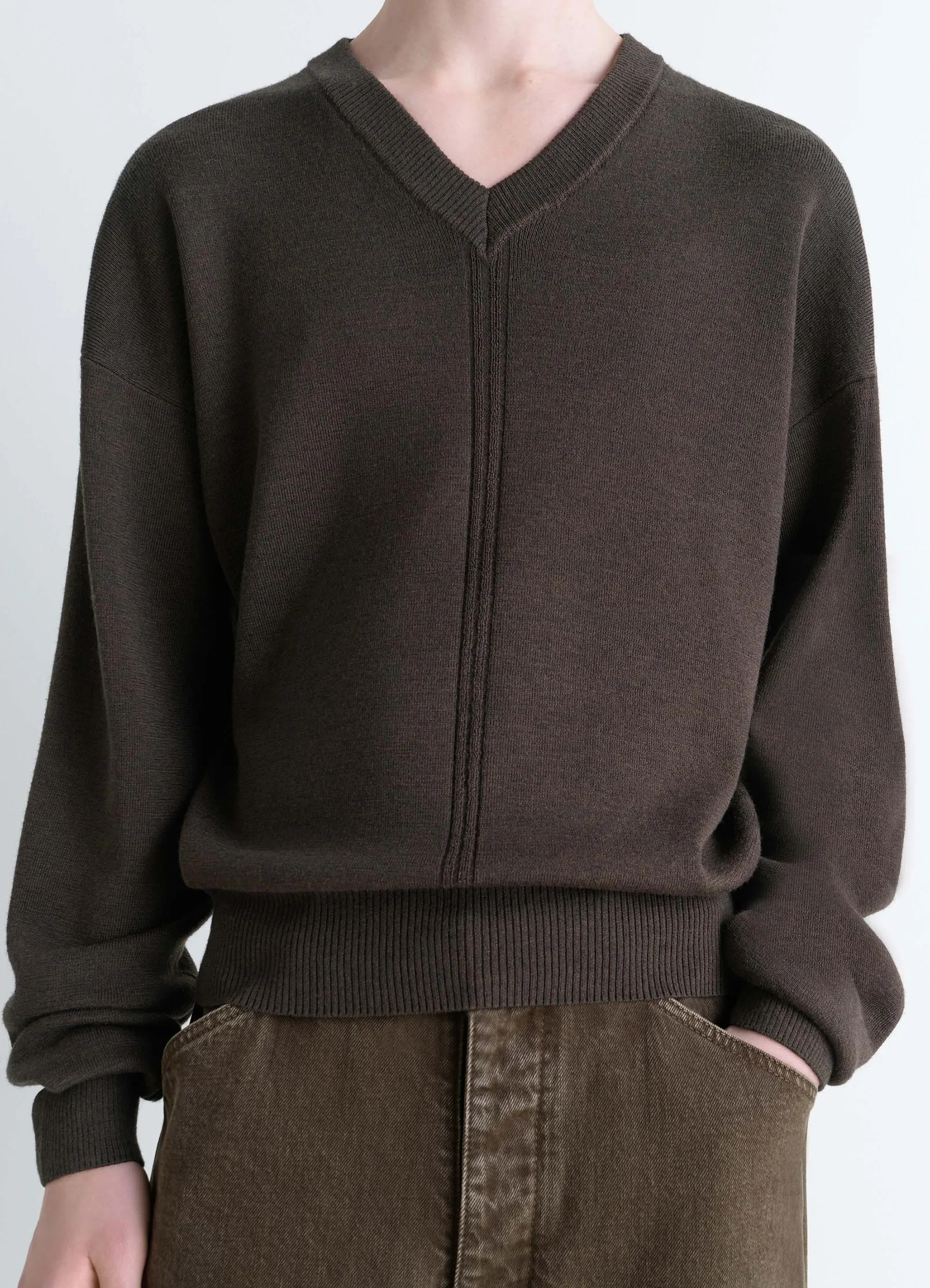 Lemaire v neck sweater in blended merino wool, model shot, close-up view ribbed hem and cuffs
