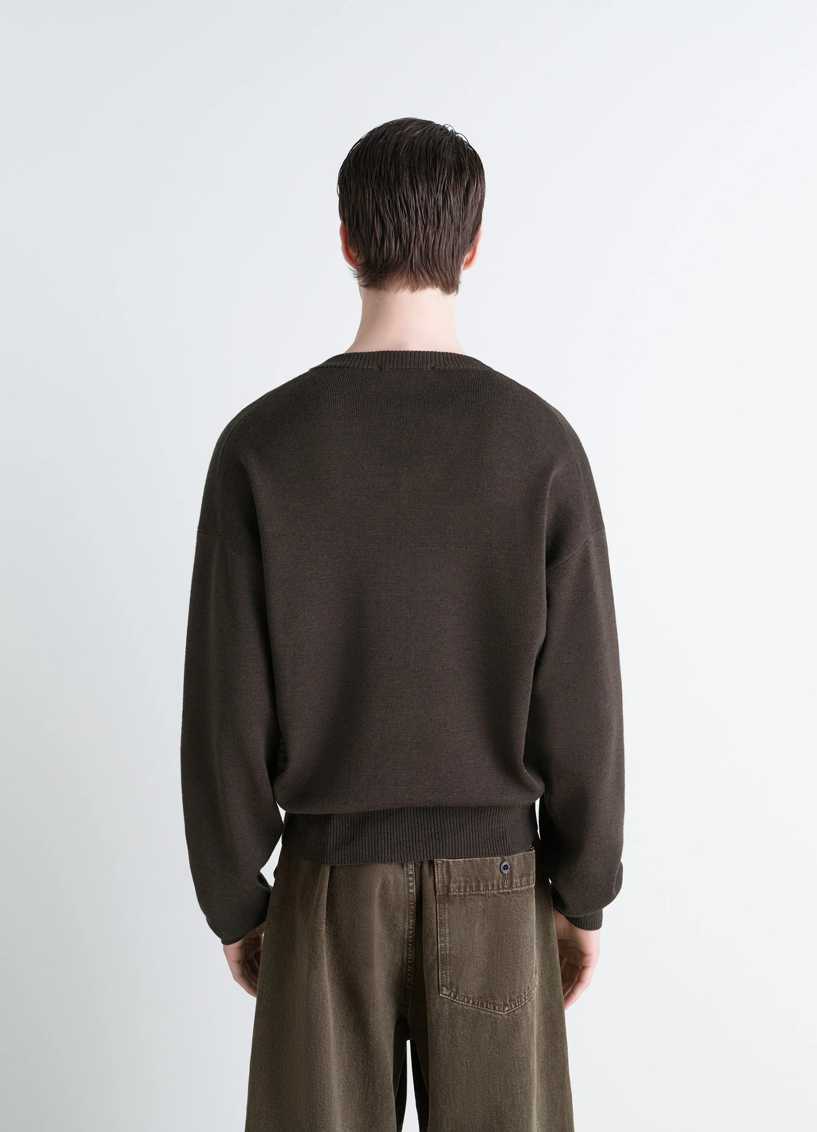Lemaire v neck sweater in blended merino wool, model shot, back view dropped shoulders