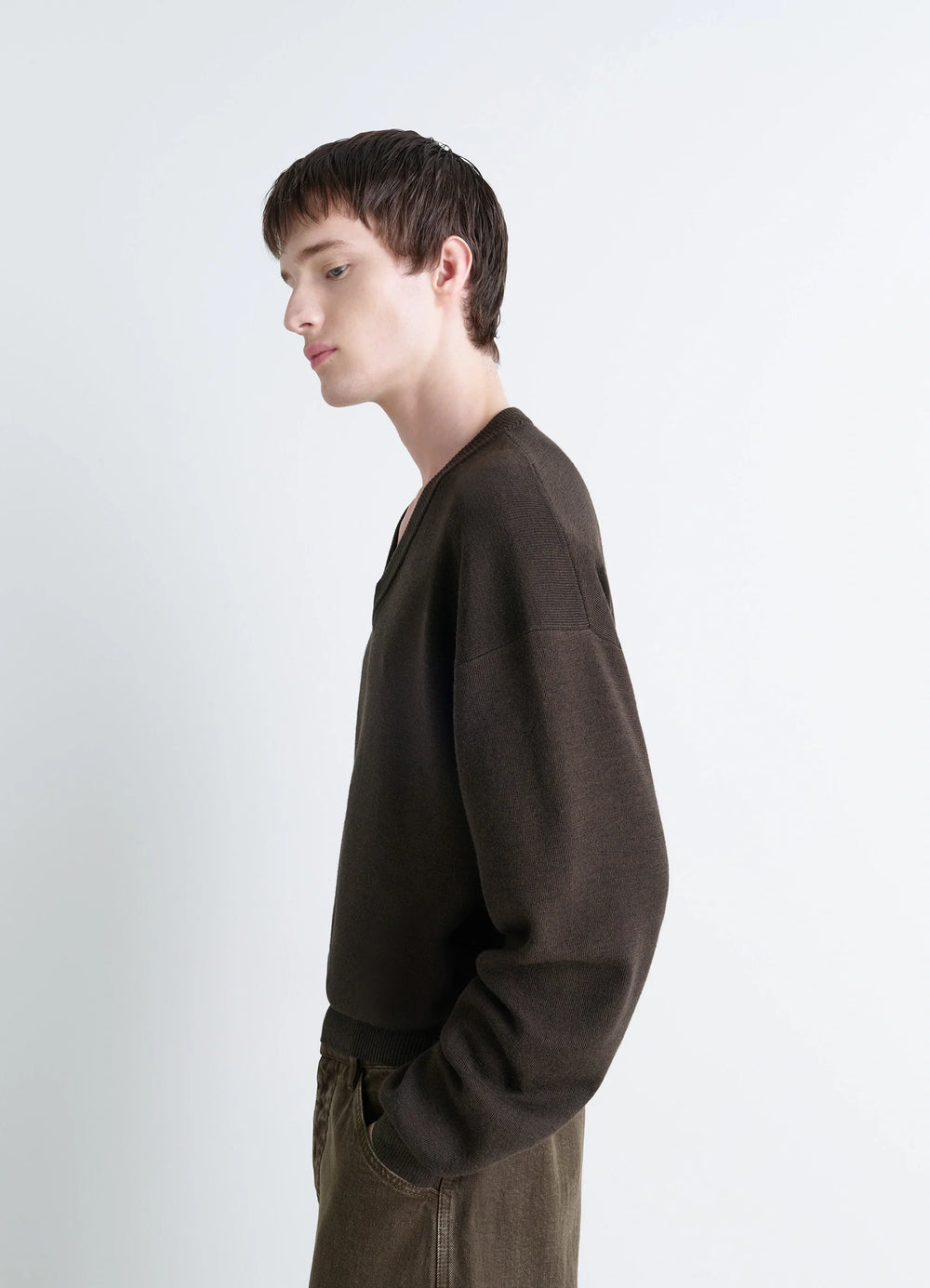 Lemaire V Neck Sweater in Blended Merino Wool, model shot, side profile view dropped shoulders view 5