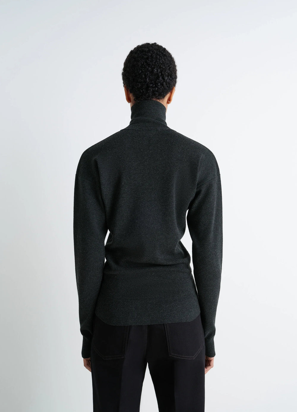 Lemaire Buttoned Fitted Cardigan in Dark Heather Mercerized Wool, model shot, back view ribbed cuffs and hem