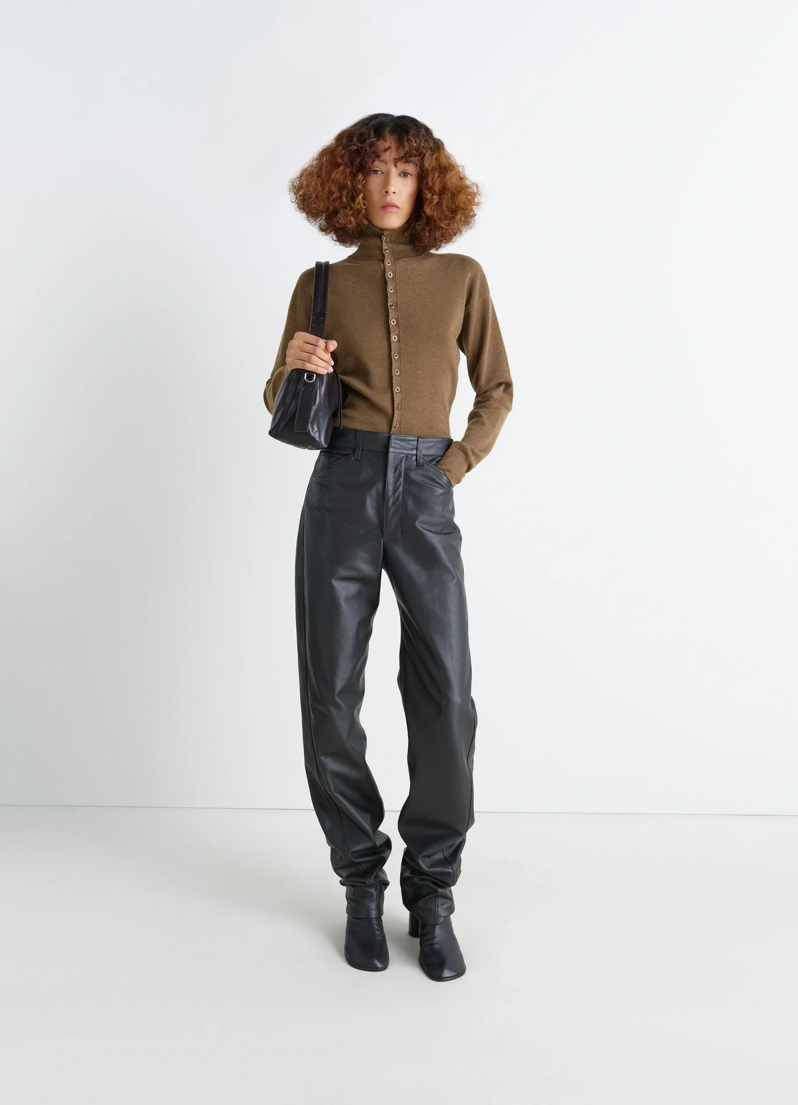 Lemaire buttoned fitted cardigan in mercerized wool, model shot, side view button detail