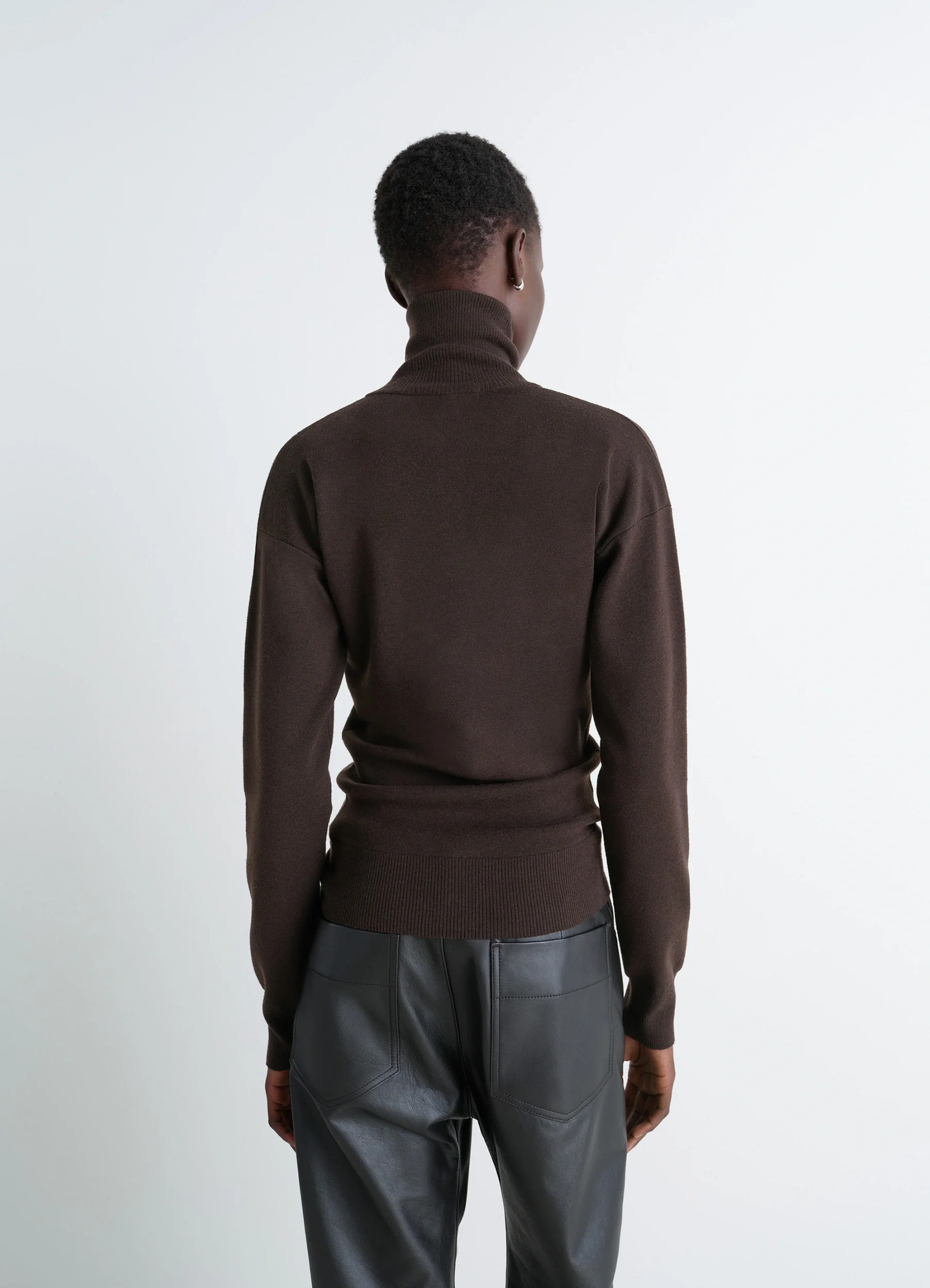 Lemaire buttoned fitted cardigan in brown mercerized wool, model shot, back view ribbed hem, fitted style