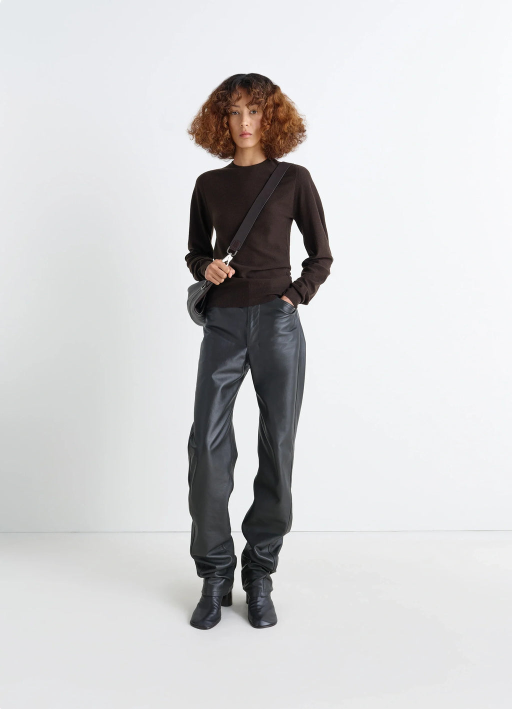 Lemaire Crew Neck Sweater in Lightly Mercerized Wool, model shot, three-quarter view subtle sheen