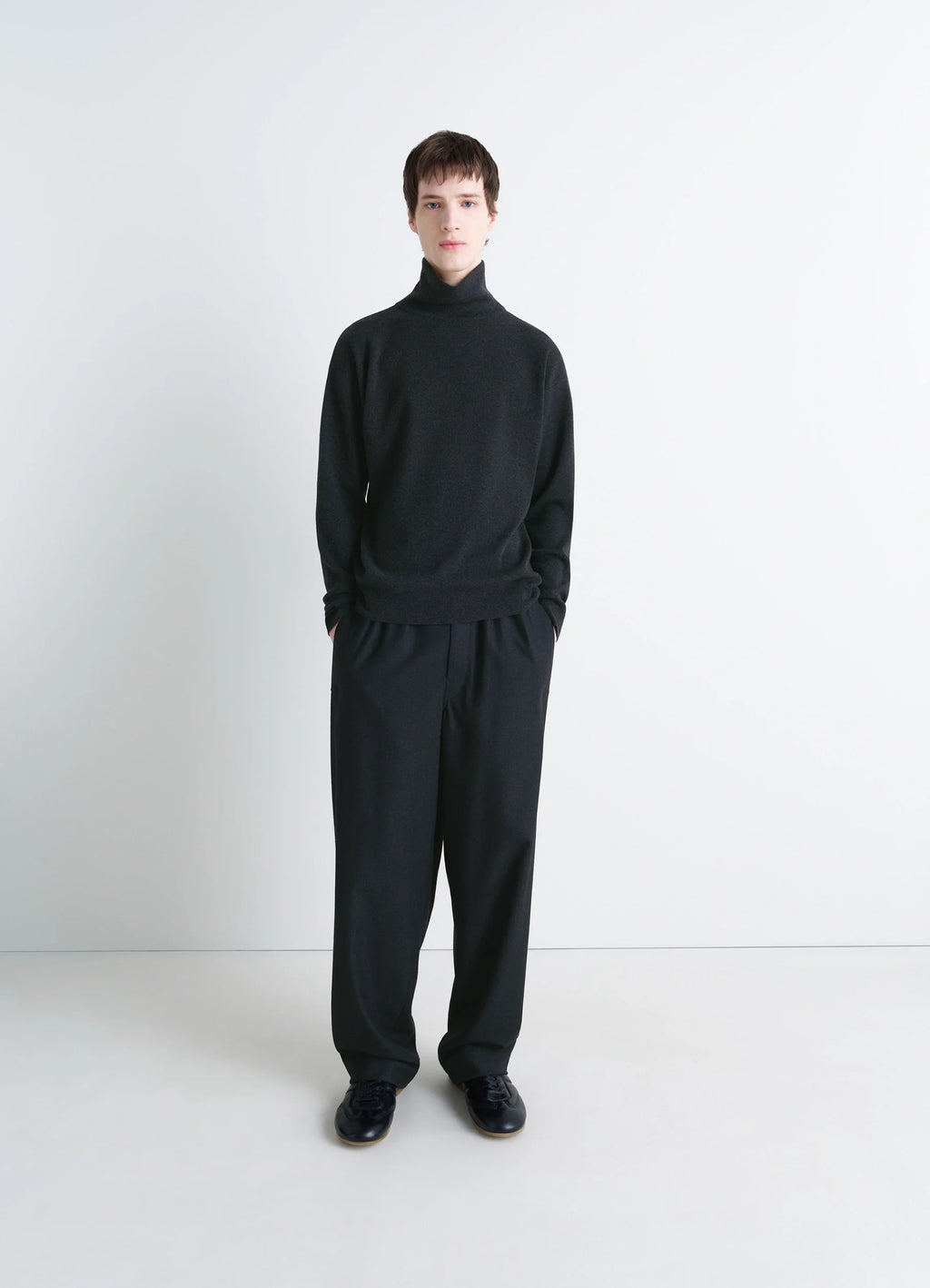 Lemaire High Neck Sweater in Lightly Mercerized Wool, model shot, side view high neck relaxed