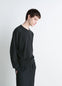 Lemaire Crew Neck Sweater in Lightly Mercerized Wool, Dark Gray, model shot, Side view Relaxed fit