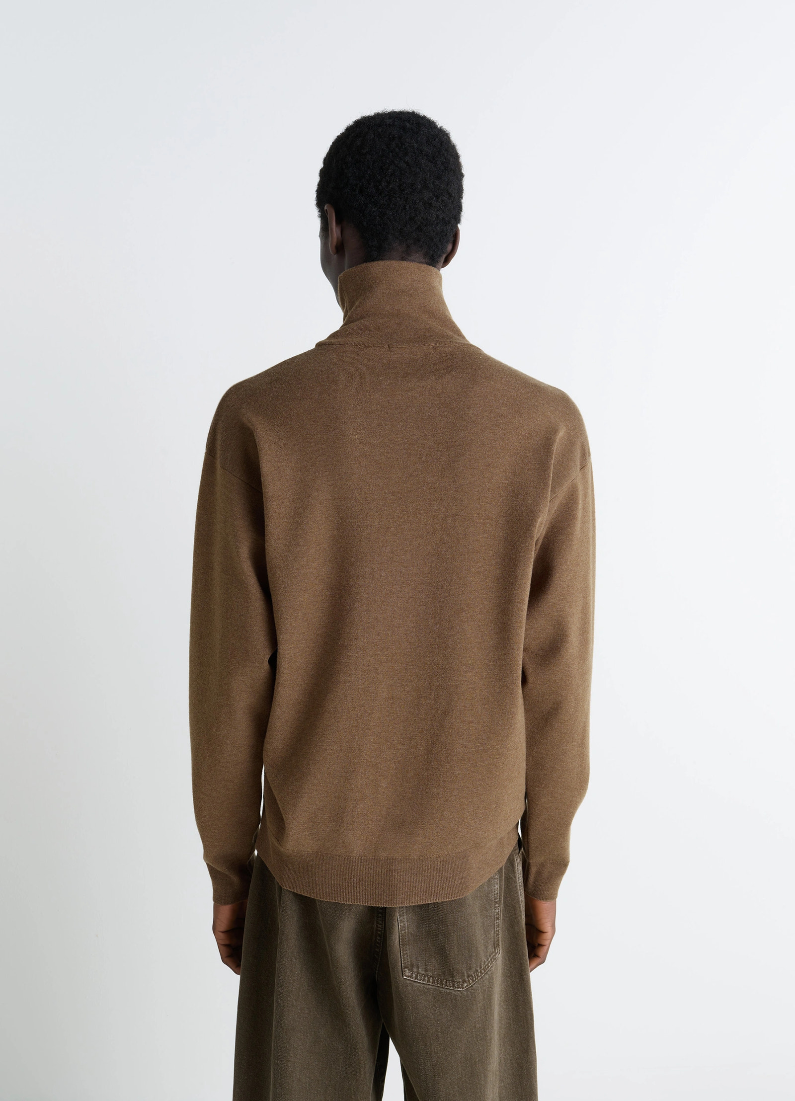 Lemaire high neck sweater in lightly mercerized wool, model shot, back view high neck, ribbed hem
