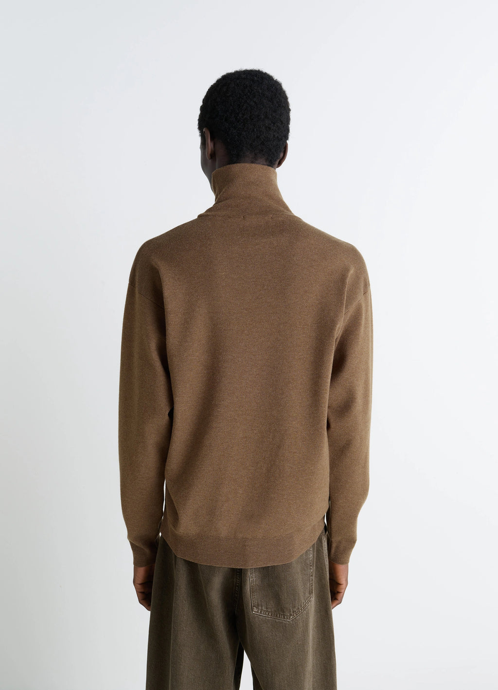 Lemaire High Neck Sweater in Lightly Mercerized Wool, model shot, back view high neck, ribbed hem