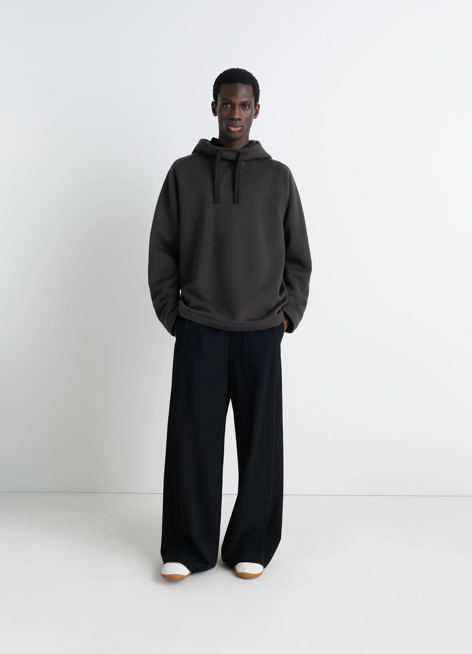 Lemaire hooded sweatshirt in wool cotton blend, model shot, front view relaxed fit, brushed interior
