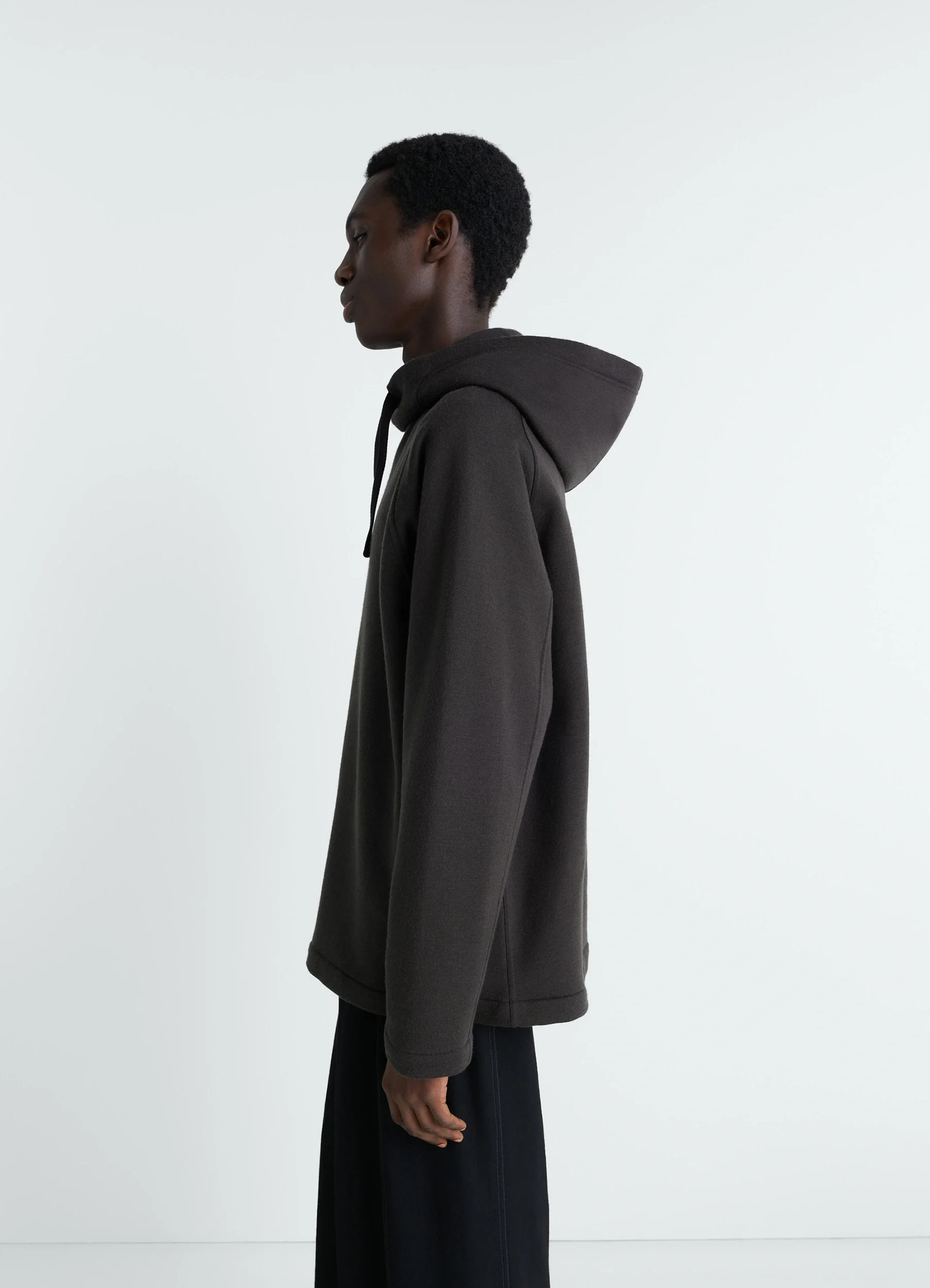 Lemaire hooded sweatshirt in wool cotton blend, model shot, side view drop shoulder seam