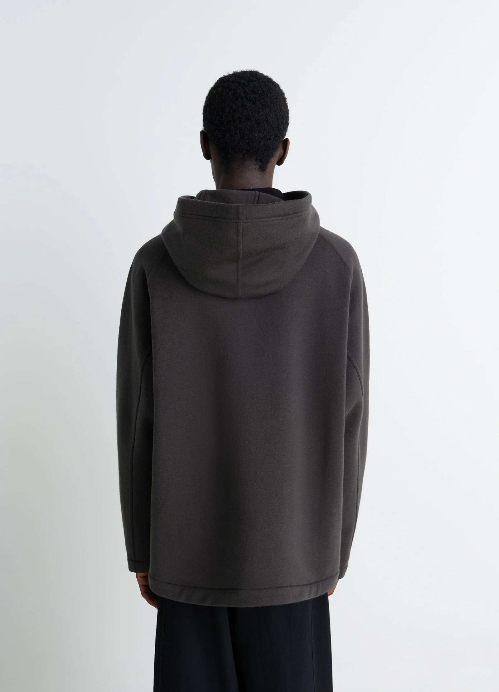 Lemaire hooded sweatshirt in wool cotton blend, model shot, back view straight hem cut