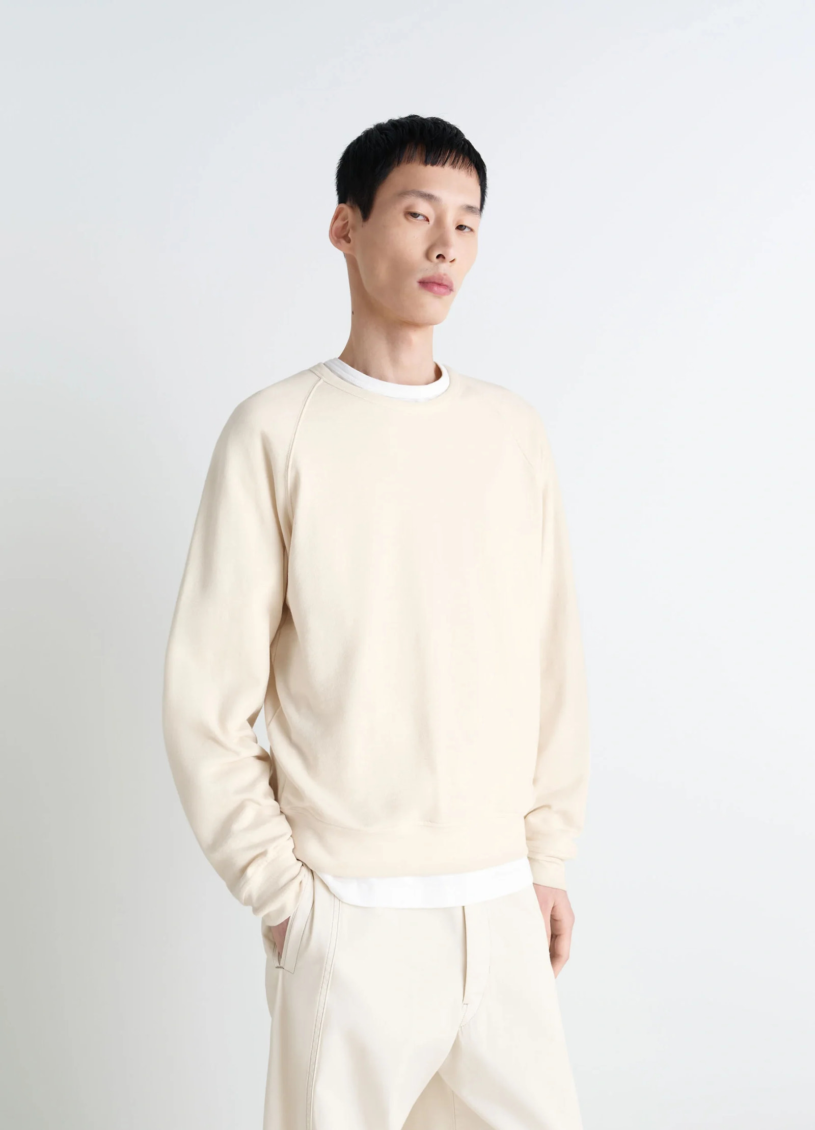 Lemaire crew neck sweatshirt in cotton wool blend beige, model shot, side view relaxed fit