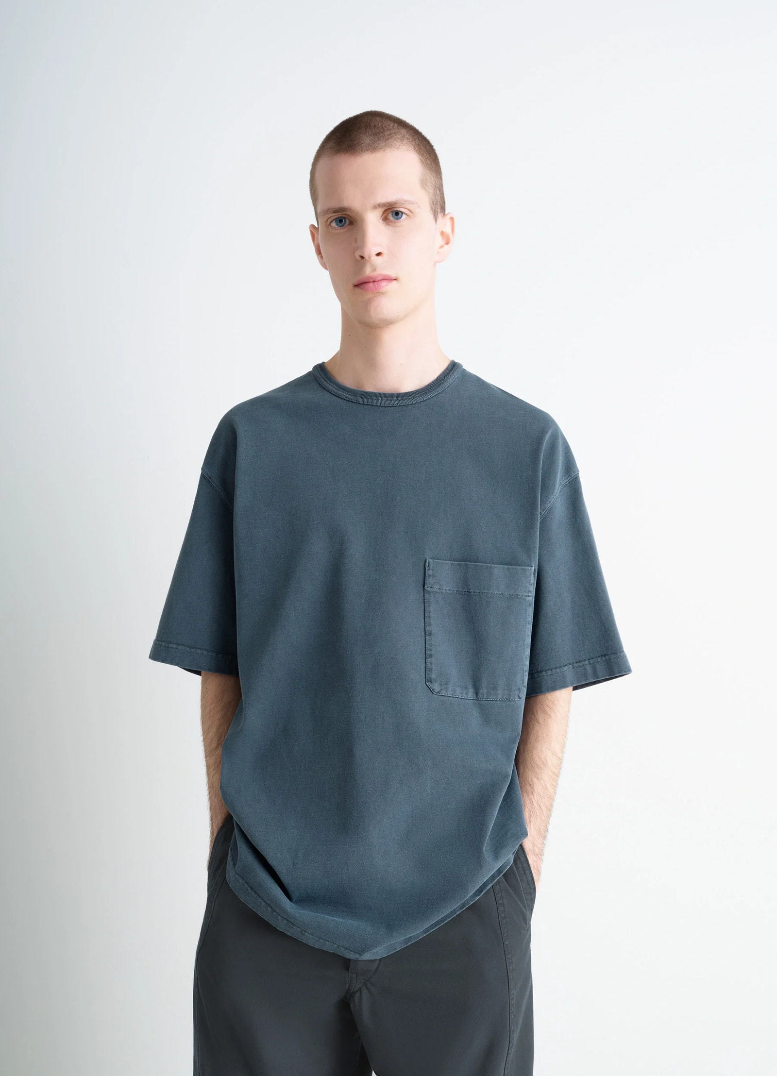 Lemaire short sleeve t-shirt in garment dyed cotton, model shot, front view relaxed fit with pocket
