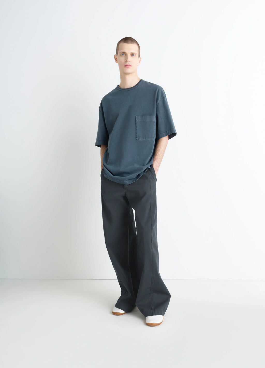 Lemaire Short Sleeve T-Shirt in Garment Dyed Cotton, model shot, three-quarter view oversized with pocket