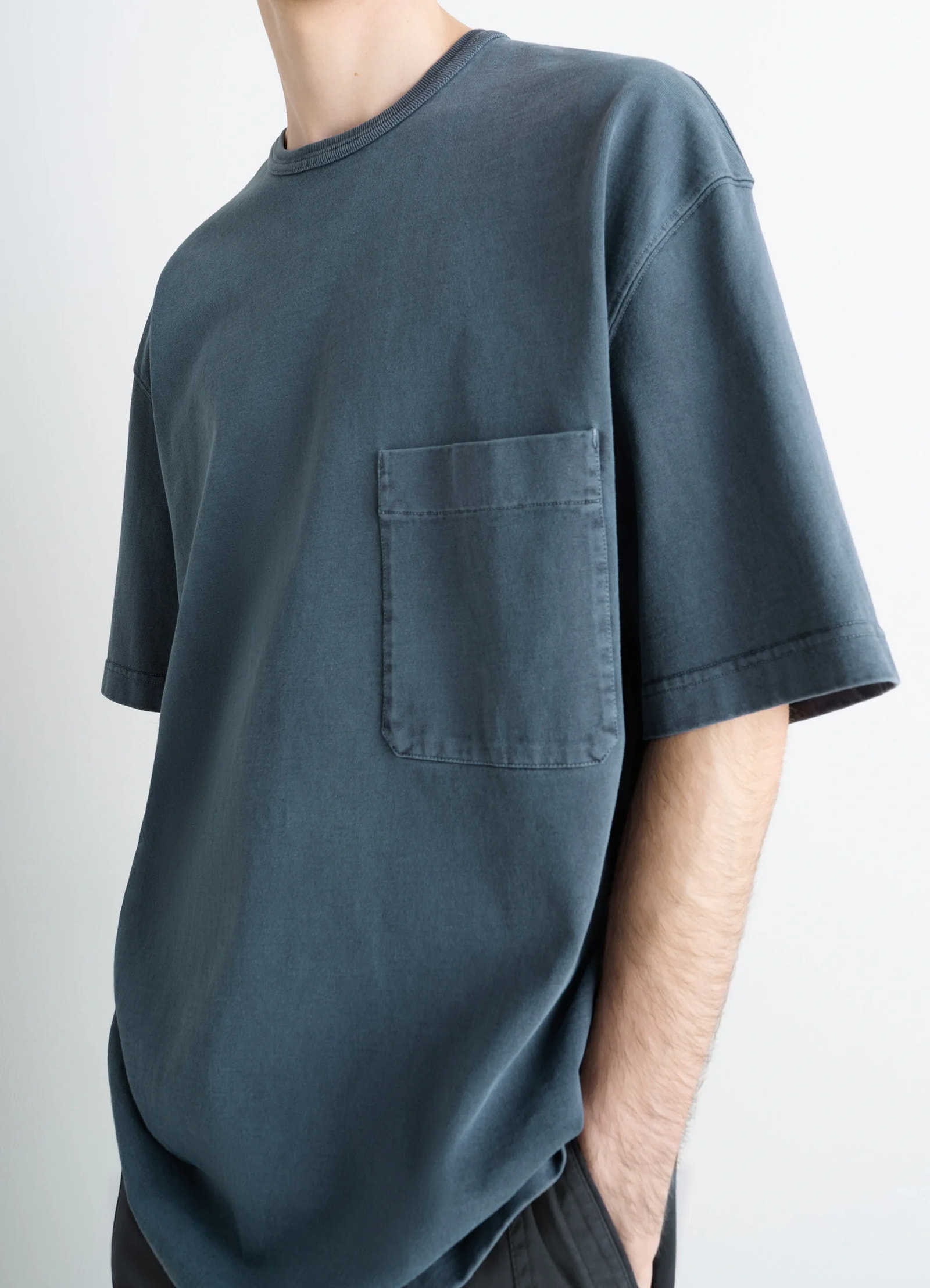 Lemaire short sleeve t-shirt in garment dyed cotton, model shot, side close-up view drop shoulder detail