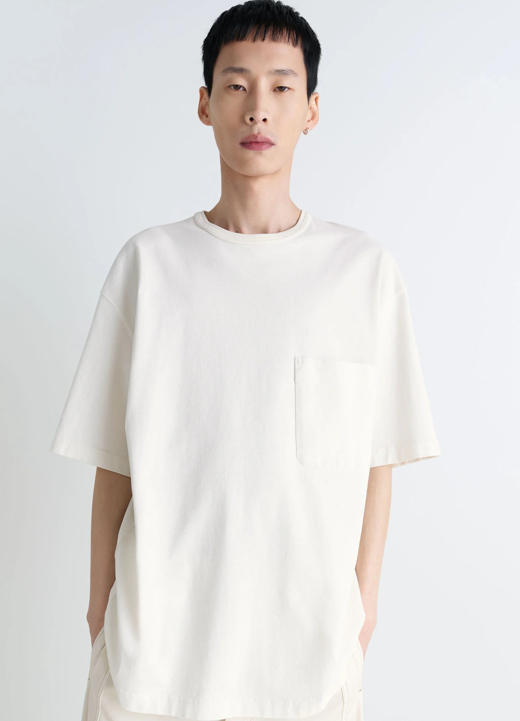 Lemaire Short Sleeve T-Shirt in Heather Garment Dyed Cotton, model shot, front view loose fit with pocket