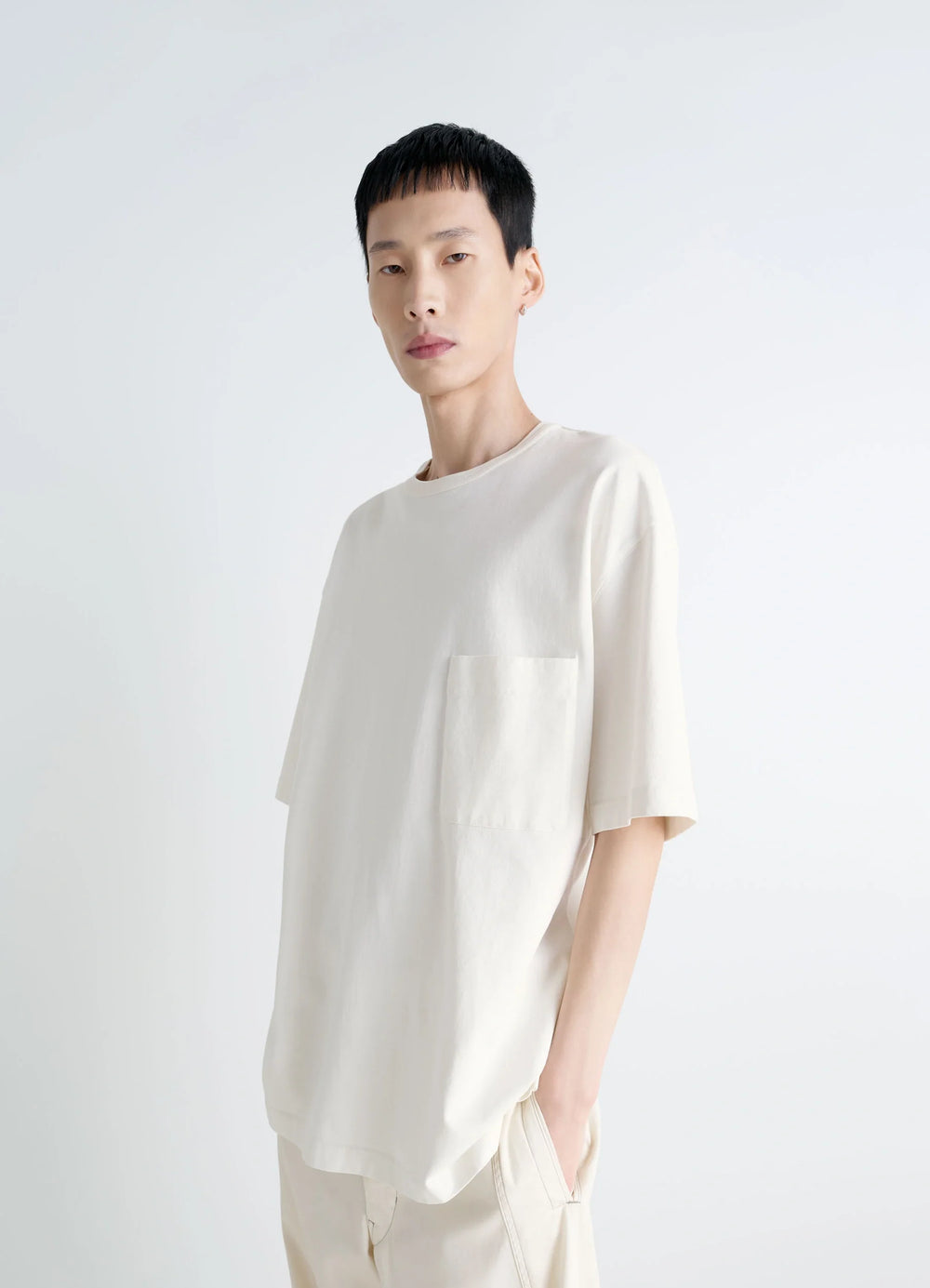 Lemaire Short Sleeve T-Shirt in Heather Garment Dyed Cotton, model shot, three-quarter view relaxed fit
