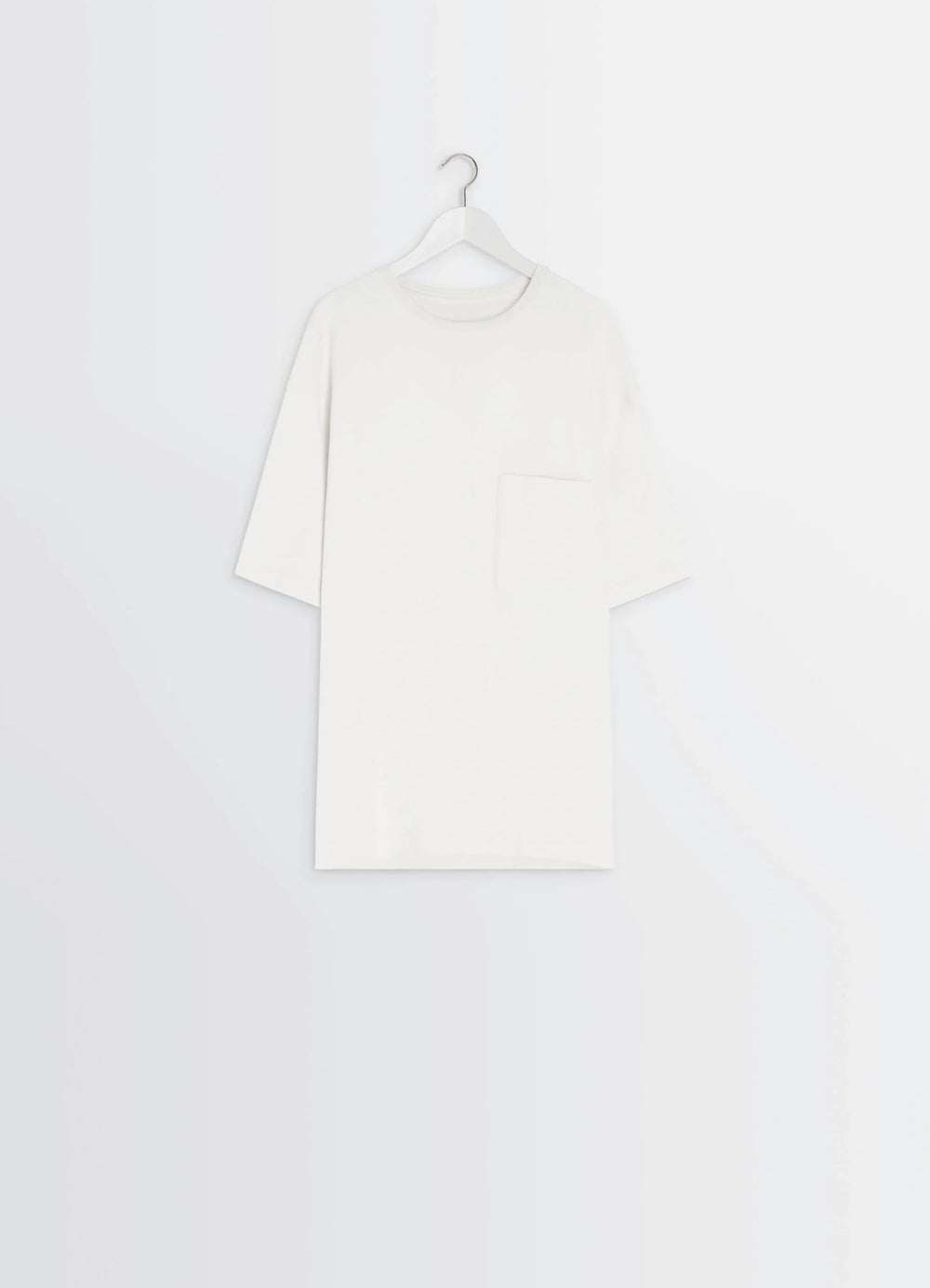 Lemaire Short Sleeve T-Shirt in Heather Garment Dyed Cotton, product shot, hanging side view minimalist pocket feature