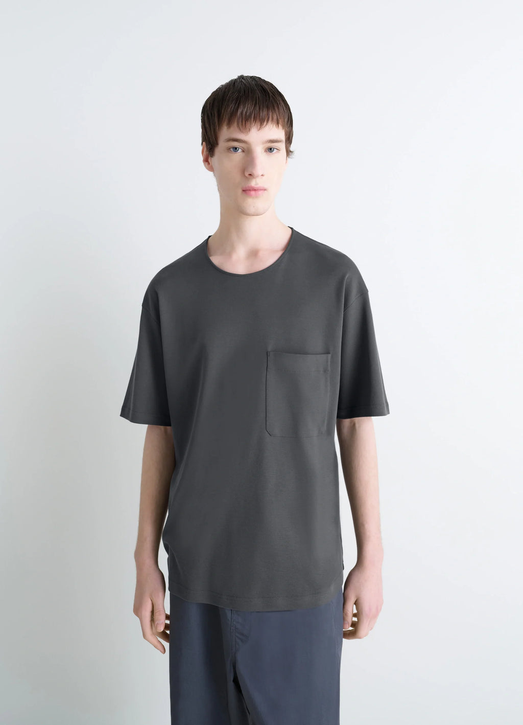 Lemaire Casual Short-Sleeved T-Shir in Cotton and Silk-Blend Interlock Jer, model shot, three-quarter view chest pocket detai