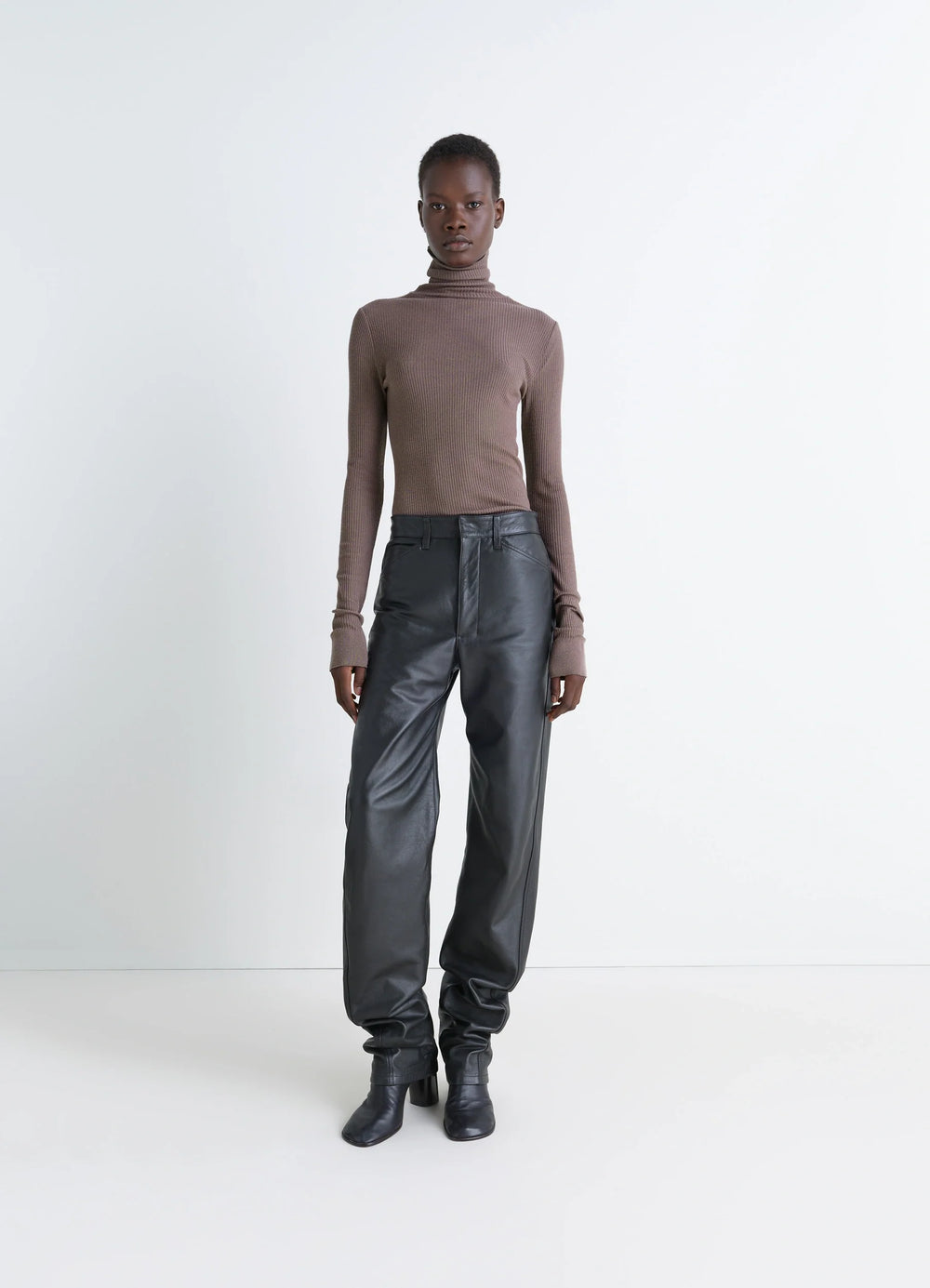 Lemaire Seamless High Neck Top in Ribbed Merino Wool, model shot, side view long sleeves