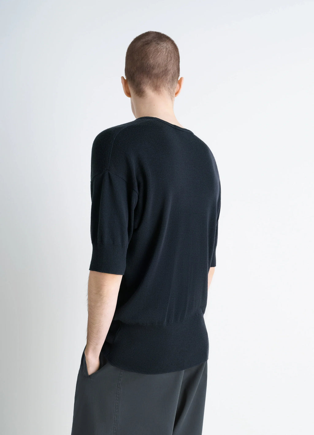 Lemaire Short Sleeves Top in Black Ribbed Merino Wool, model shot, back view dropped shoulder seam