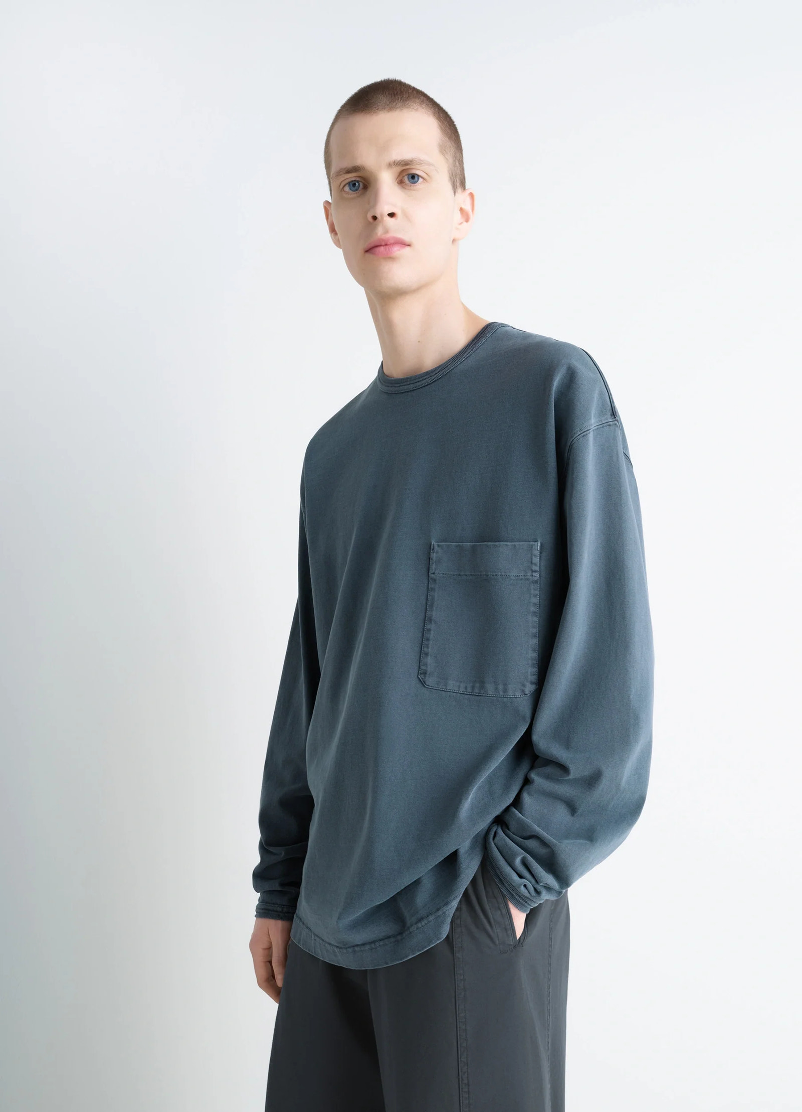 Lemaire long sleeve t-shirt in cotton jersey, model shot, front diagonal view chest pocket loose fit