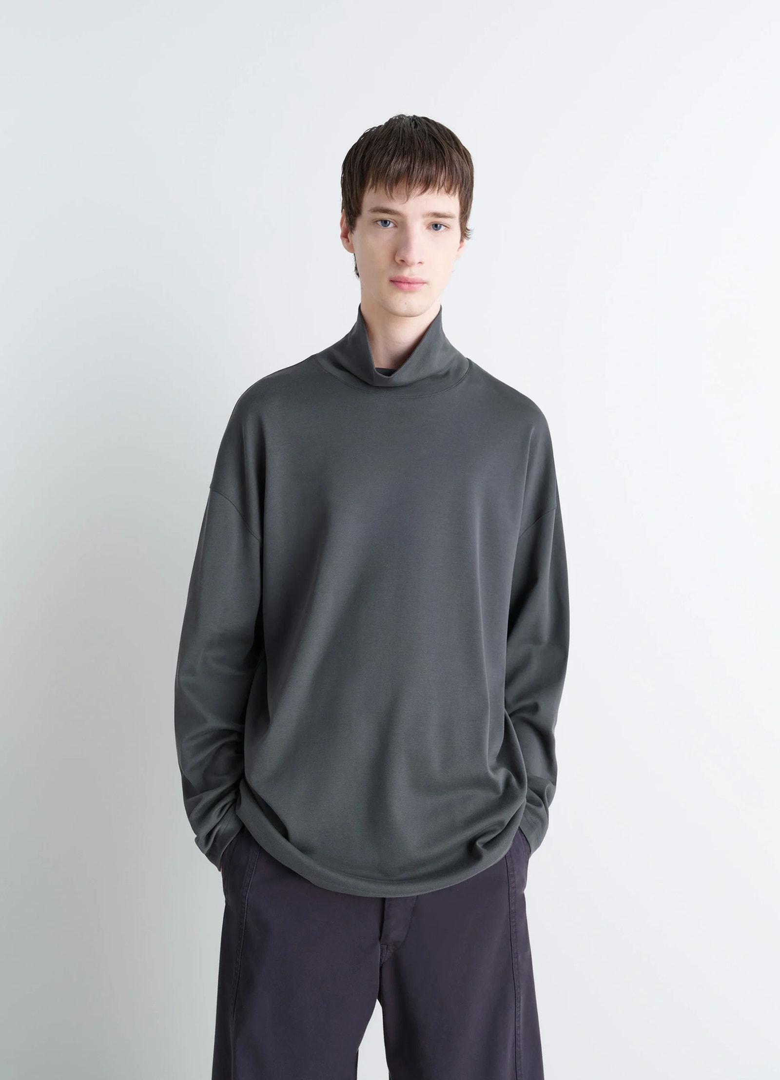 Lemaire relaxed mock neck t-shirt in dark gray cotton silk-blend, model shot, three-quarter view dropped shoulders