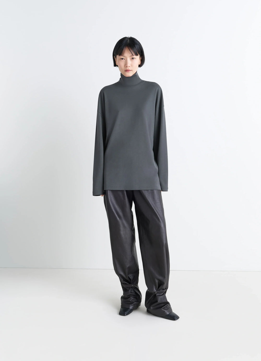Lemaire Relaxed Mock Neck T-shirt in Dark Gray Cotton Silk-blend, model shot, full body front view long sleeves, mock neck