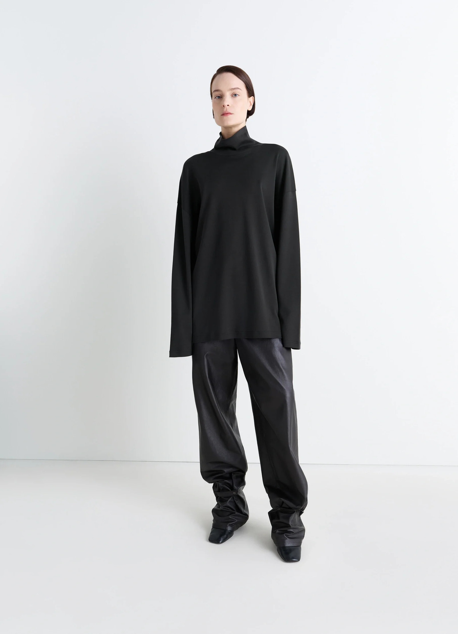 Lemaire relaxed mock neck t-shirt in black cotton silk-blend, model shot, side view long sleeves