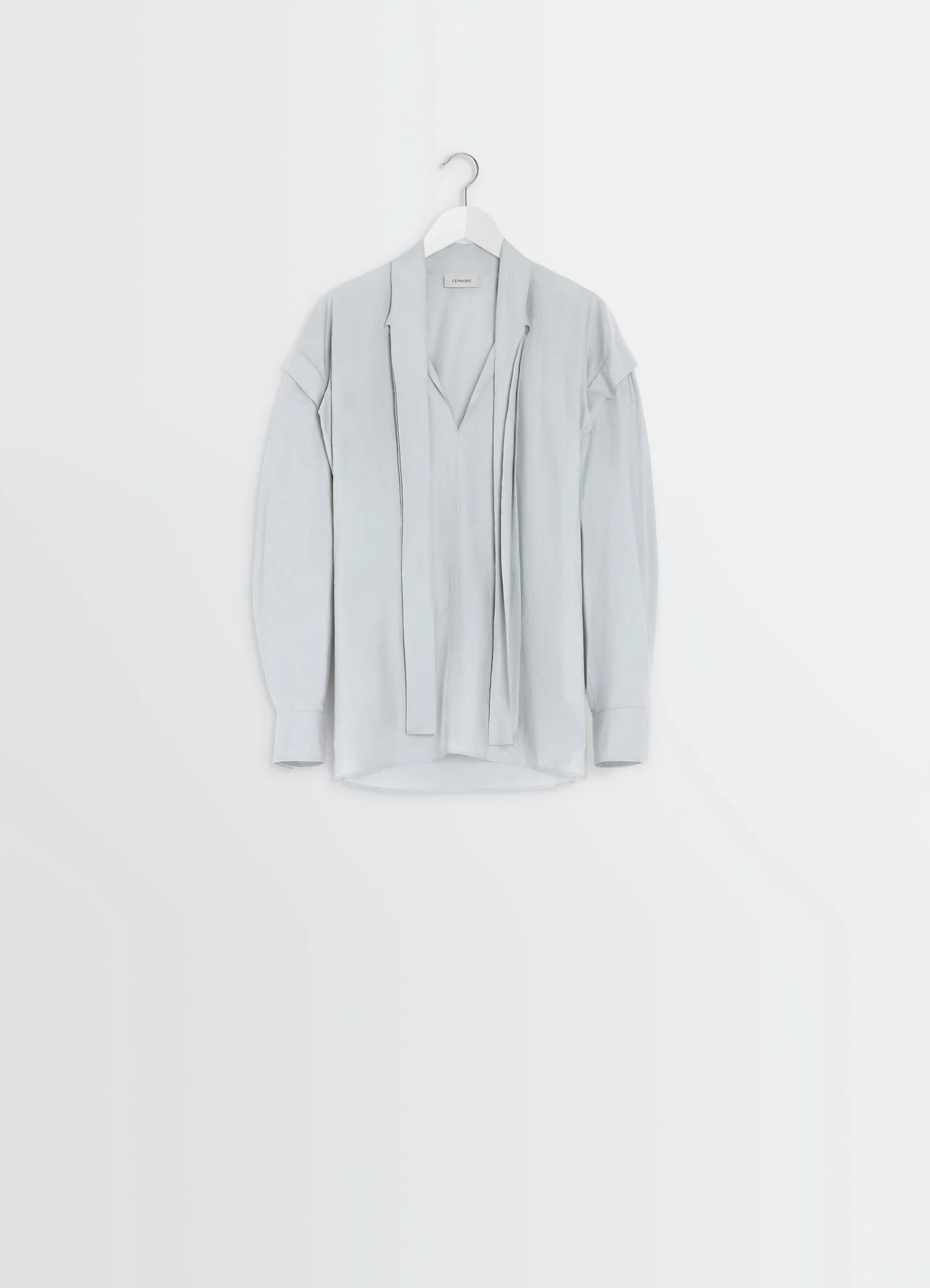 Ascot blouse in light patina washed cotton-silk, product shot, hanger view long tie detail