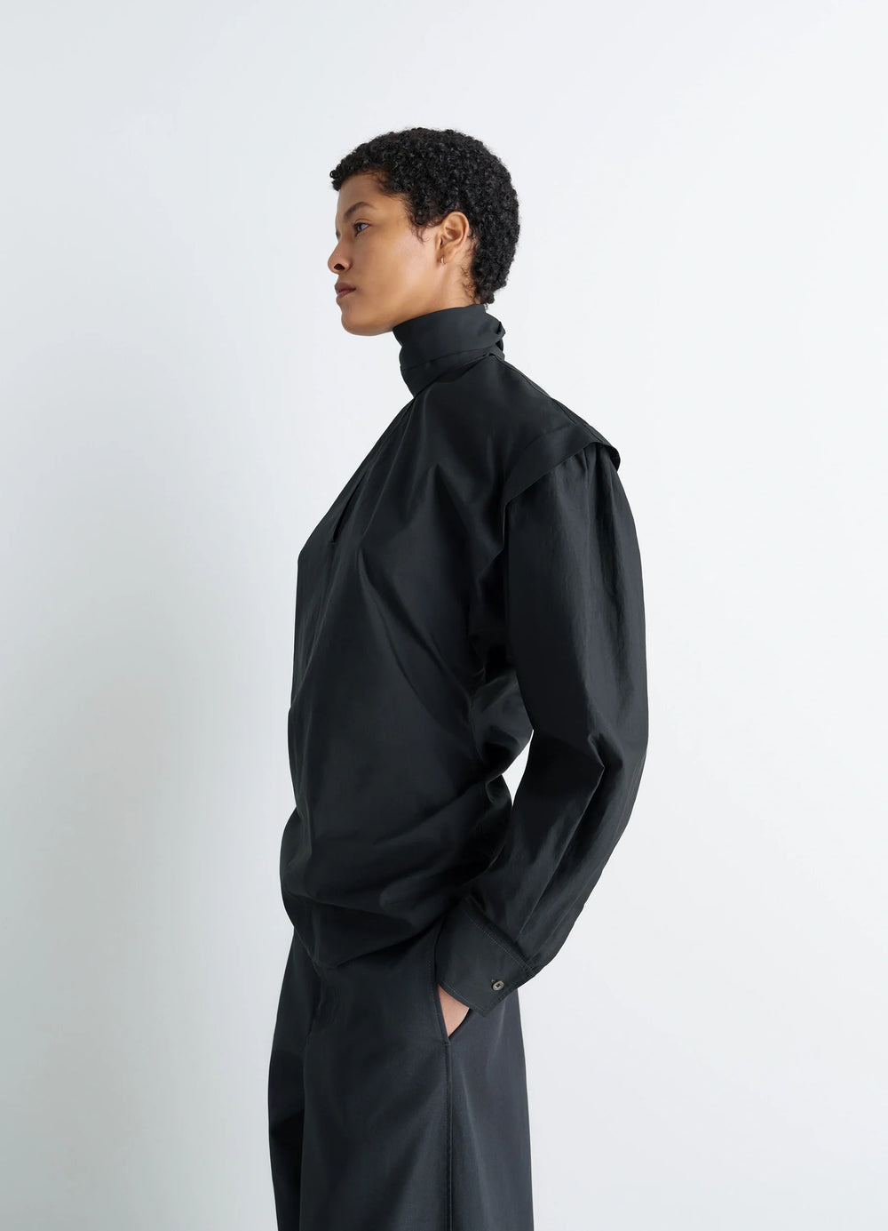 Ascot Blouse in Washed Cotton-Silk Blend, model shot, side view high neck, gathered shoulder