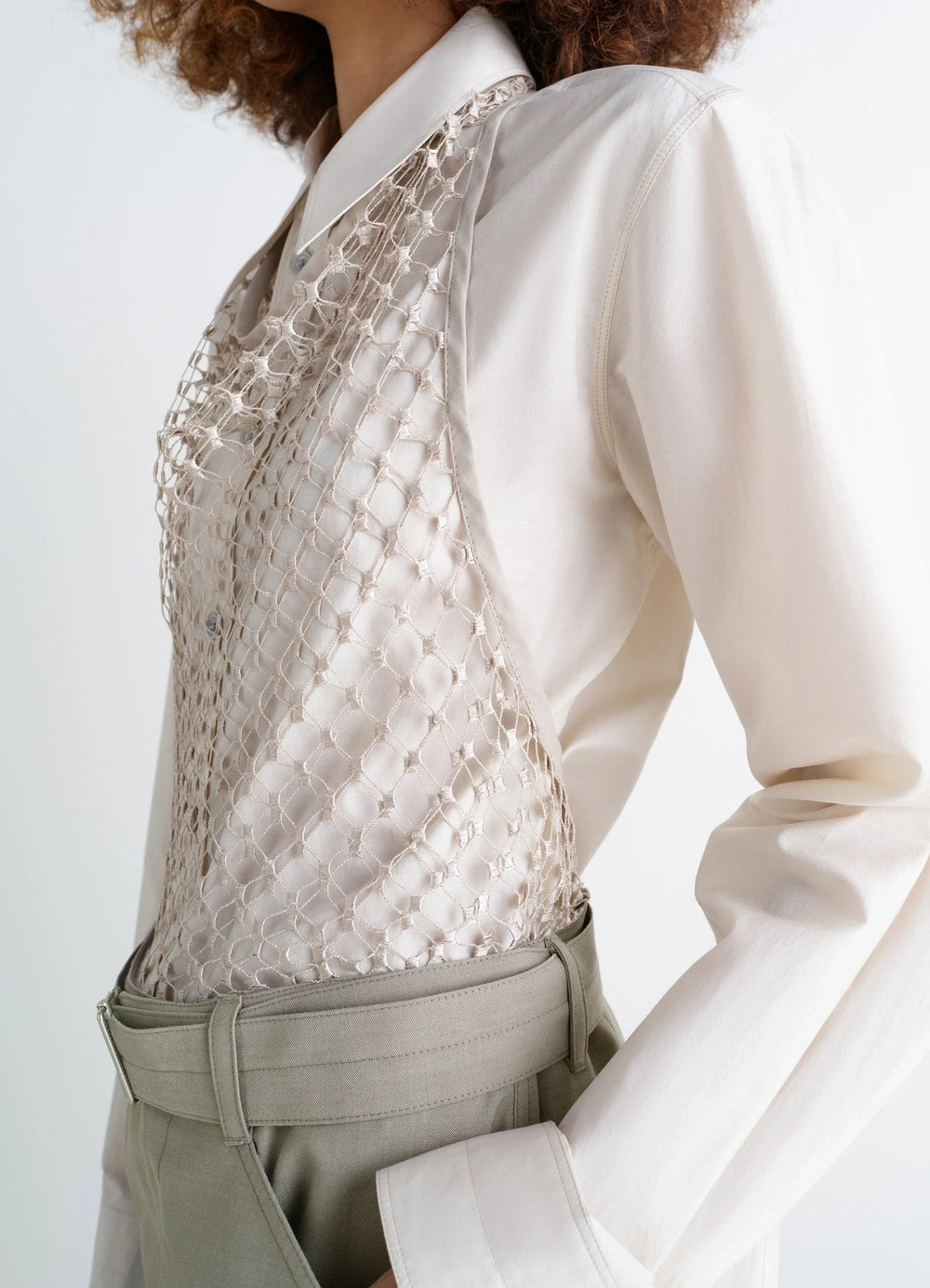 Lemaire Fishnet Halter Top in Cream Fishnet, model shot, side view worn over long-sleeve shirt