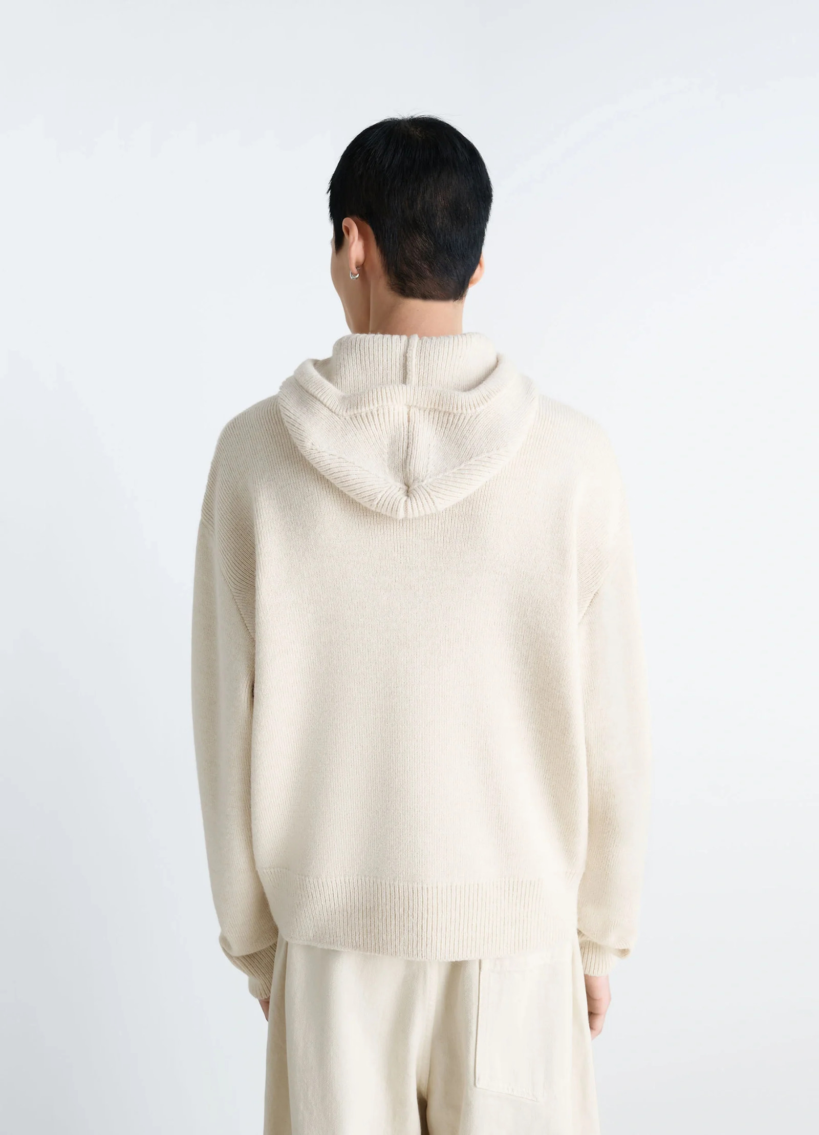 Lemaire hooded sweater in cream wool alpaca, model shot, back view drop shoulder design