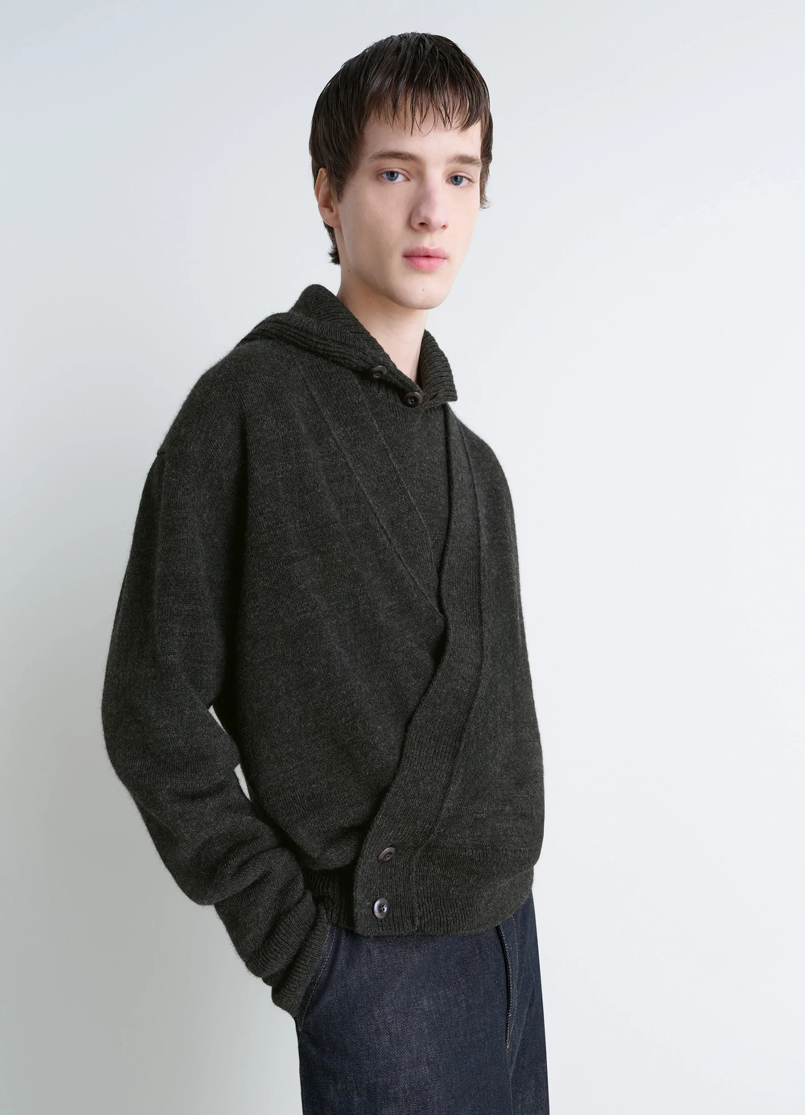 Lemaire wrap cardigan in dark wool alpaca blend, model shot, front side view double-breasted design