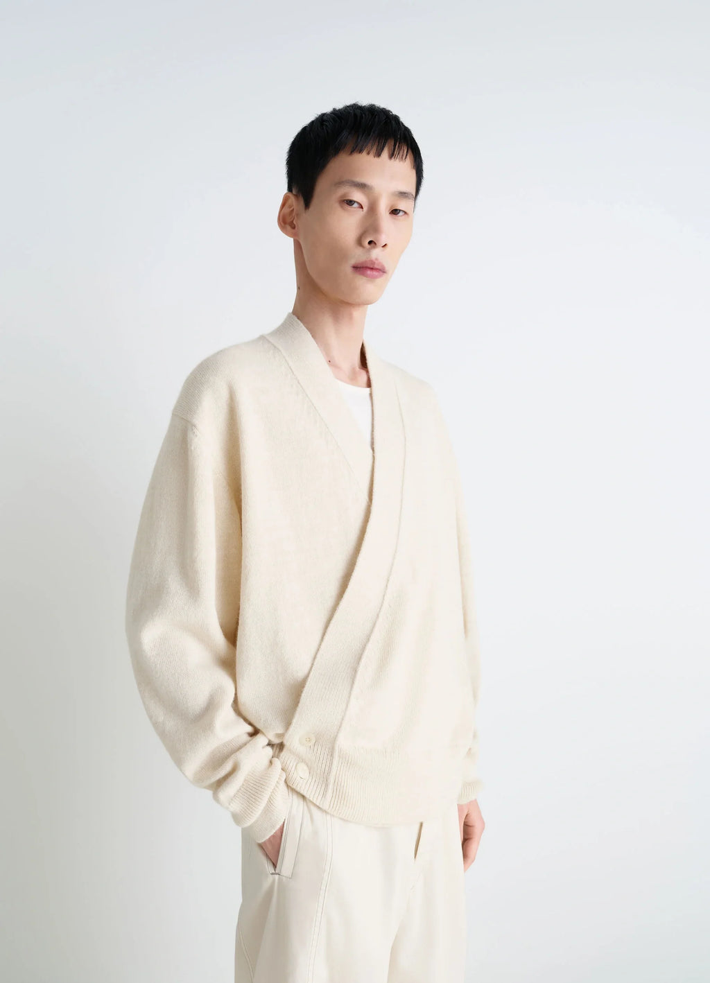Lemaire Wrap Cardigan in Ivory Wool Alpaca, model shot, Side front view Double-breasted relaxed fit