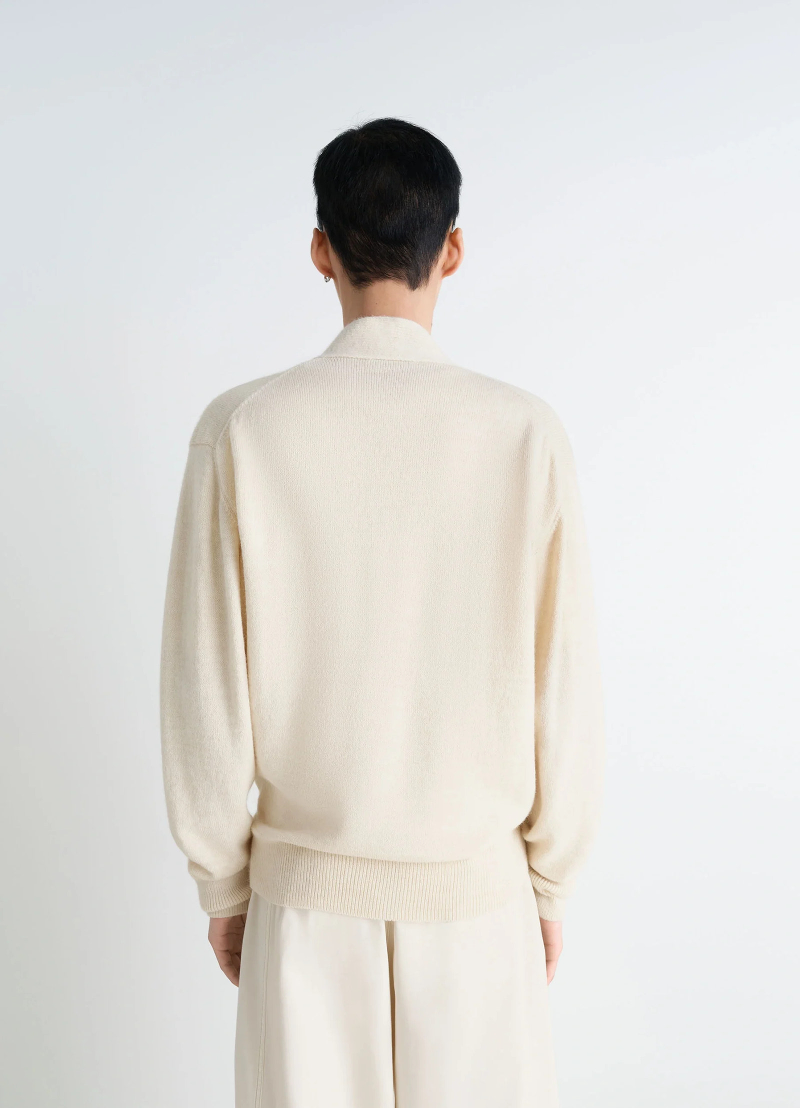 Lemaire wrap cardigan in ivory wool alpaca, model shot, back view ribbed hem and cuffs