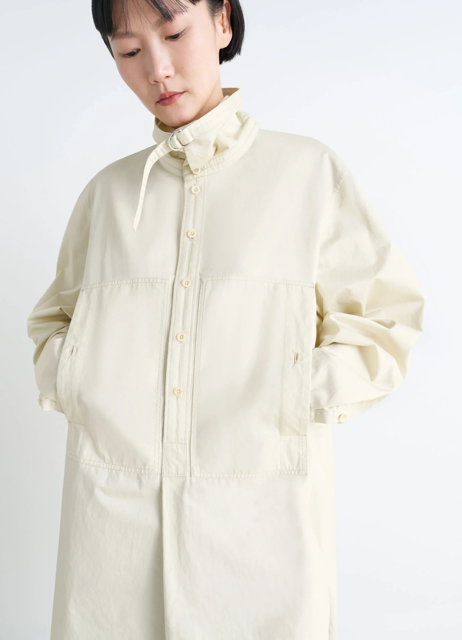Lemaire chest pocket long liquette in lightweight satin cotton, model shot, detail shot patch pockets visible