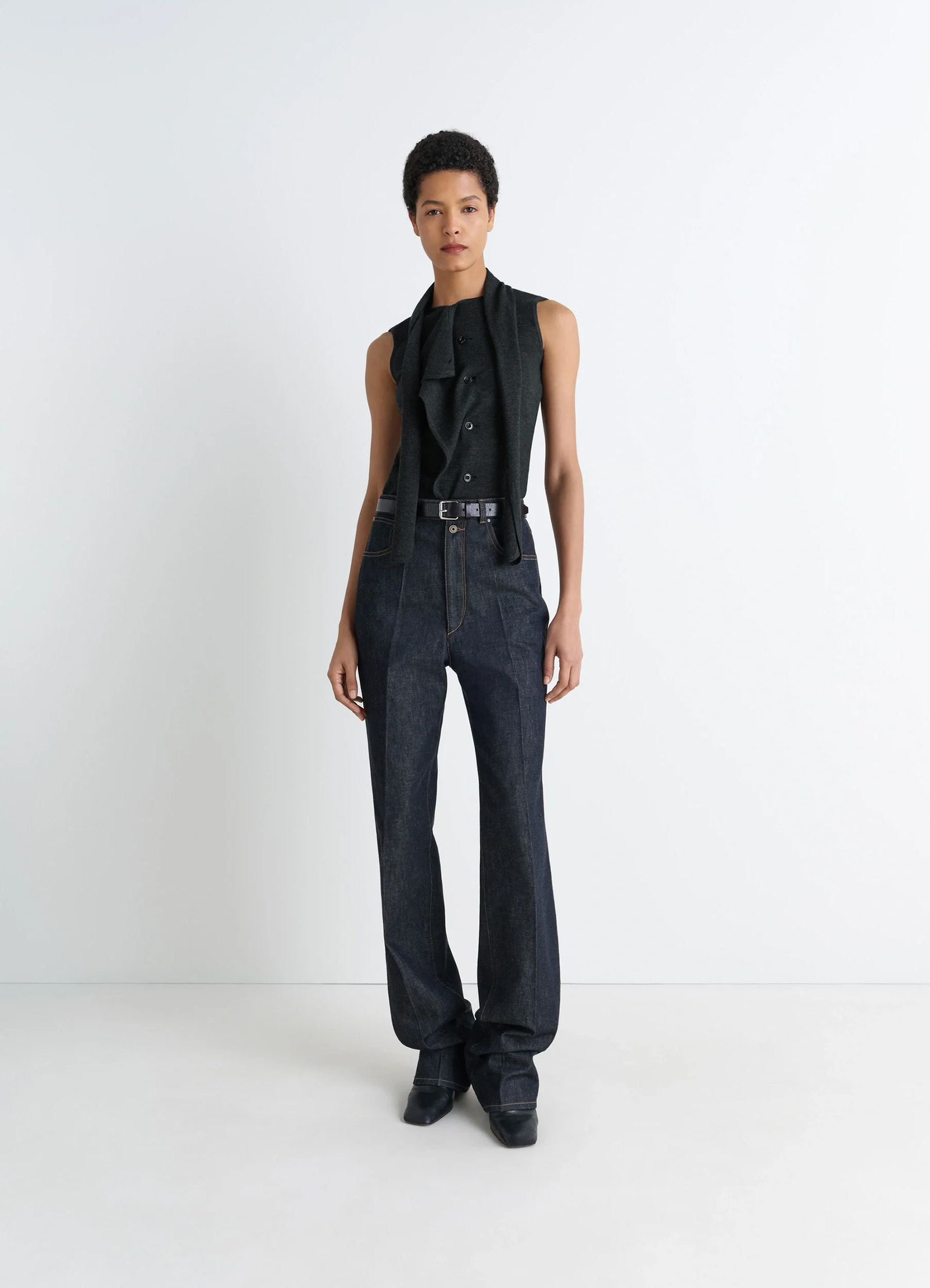 Lemaire asymmetrical sleeveless car in blended merino wool, model shot, full body side view asymmetrical drape, sleeveless