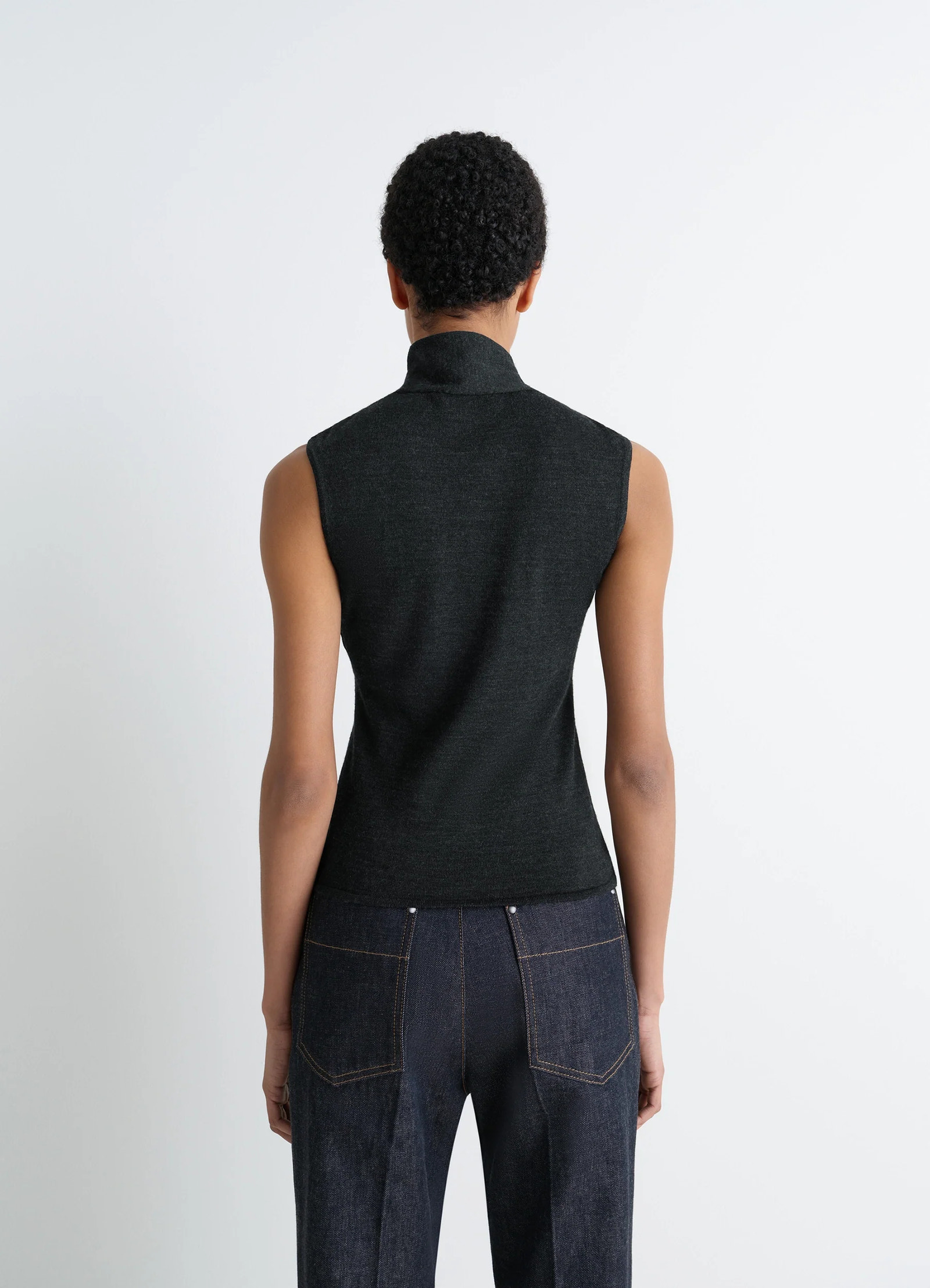 Lemaire asymmetrical sleeveless car in blended merino wool, model shot, back view turtleneck sleeveless fit