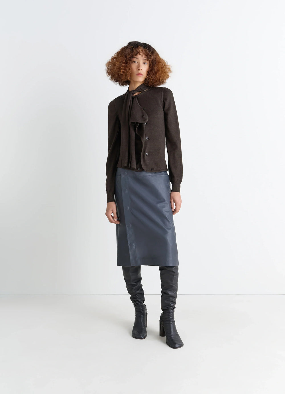 Lemaire Asymmetrical Sleeveless Car in Blended Merino Wool, model shot, side view asymmetrical button closure