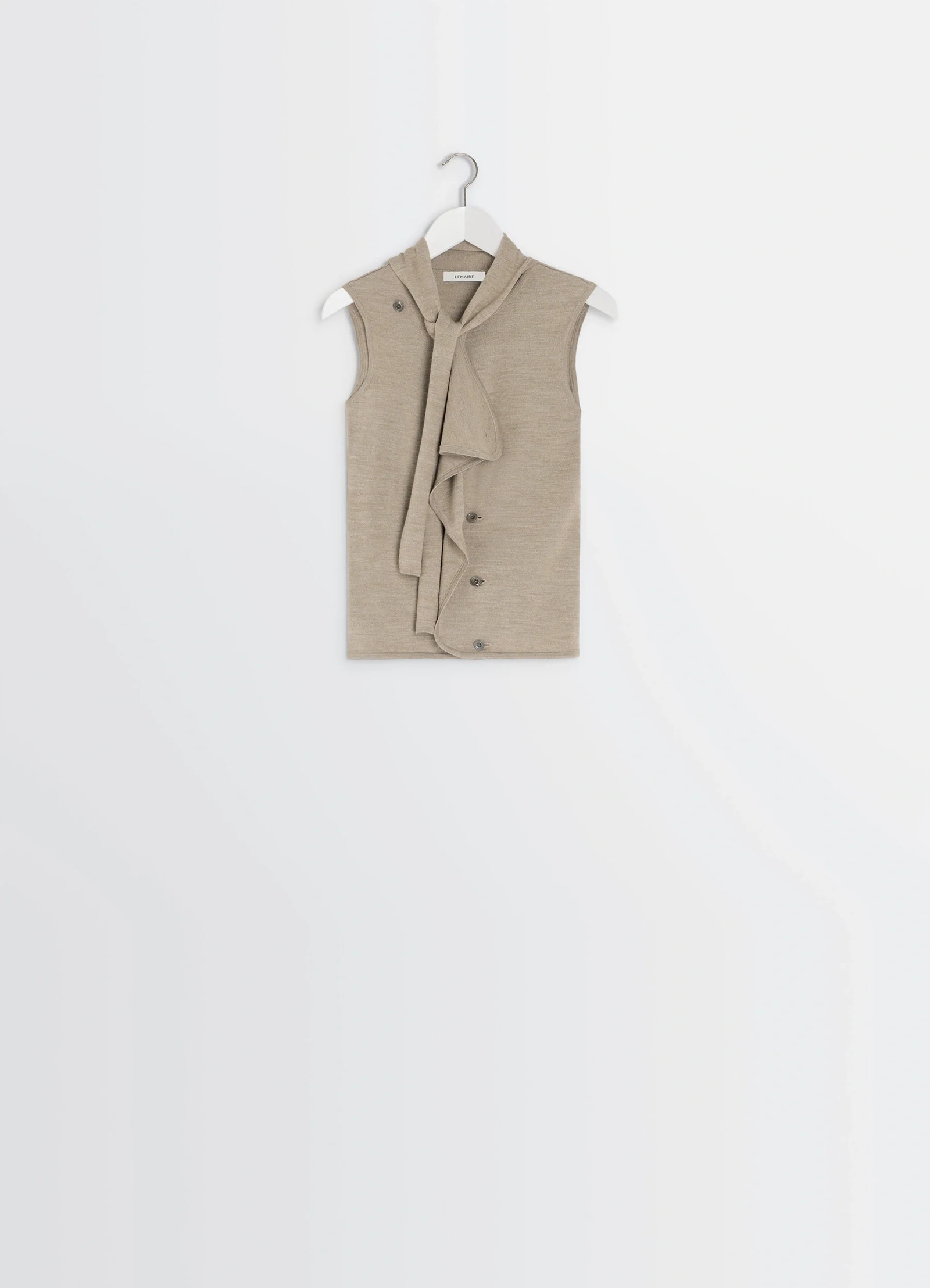 Lemaire asymmetrical sleeveless car in blended merino wool, product shot, hanging shot draped neckline buttons