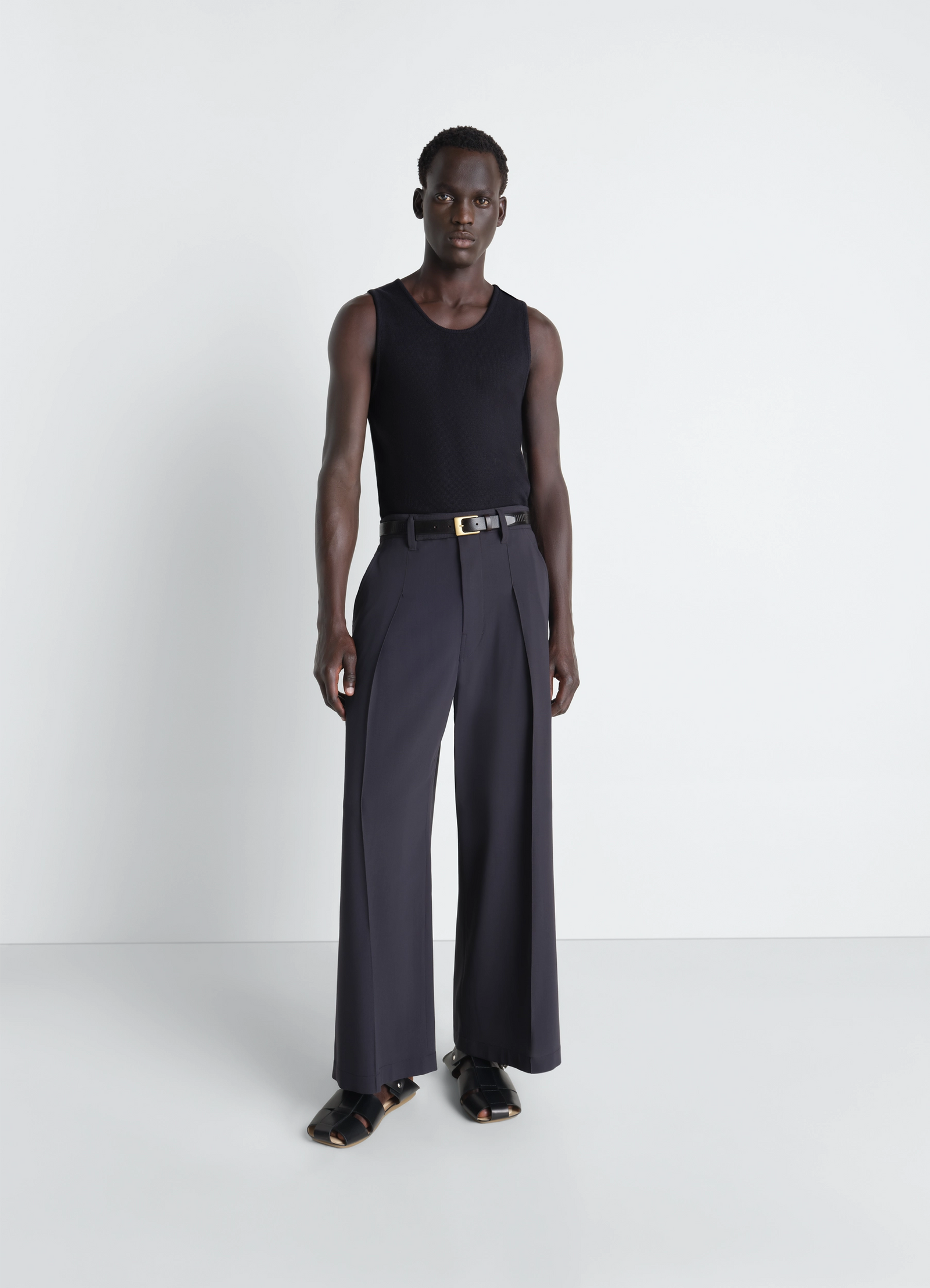 Lemaire rib tank top in black cotton jersey, model shot, three-quarter view sleeveless scoop neck