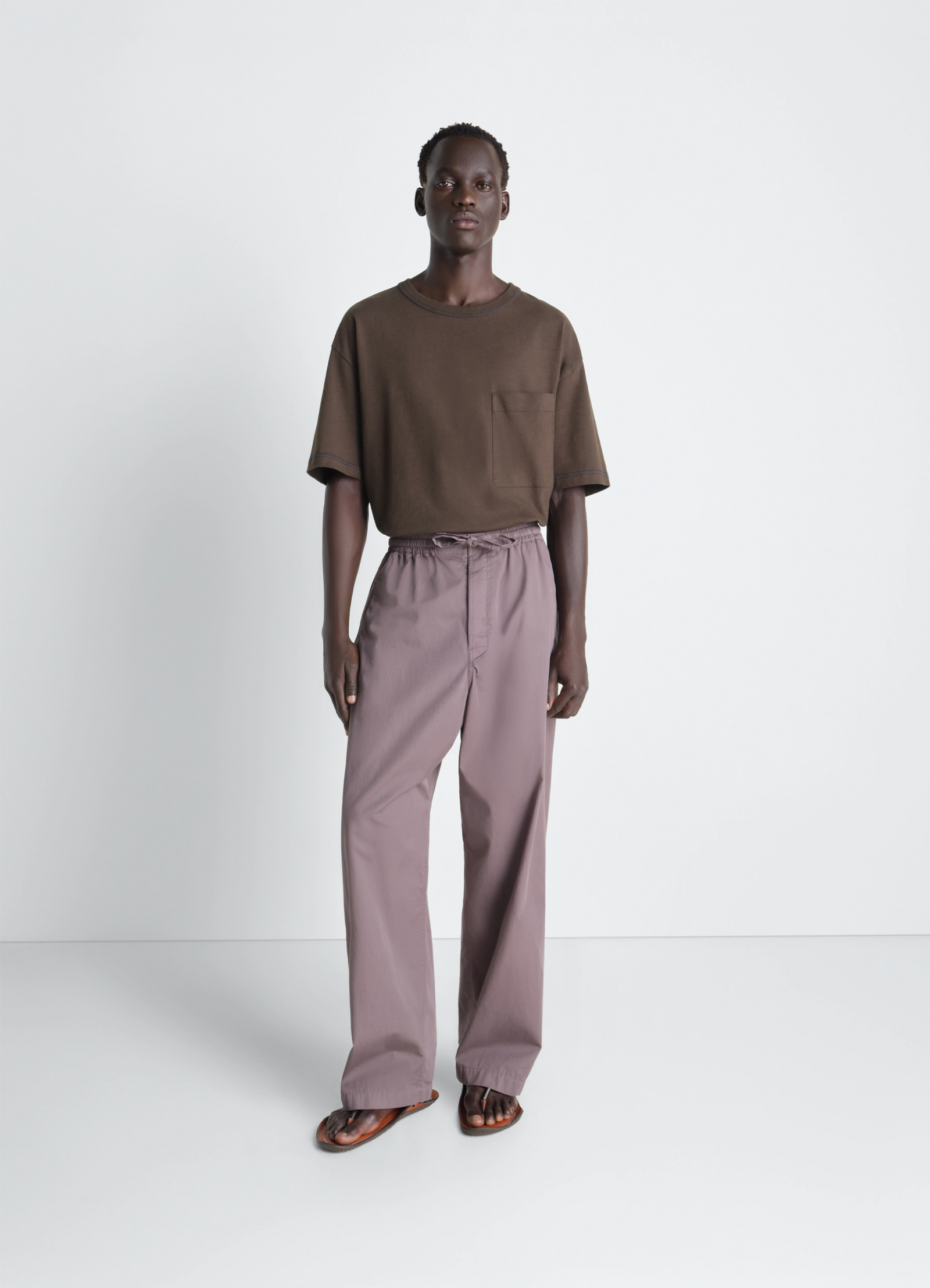 Lemaire boxy short sleeve t-shirt in brown linen cotton jersey, model shot, three-quarter view relaxed fit short sleeves