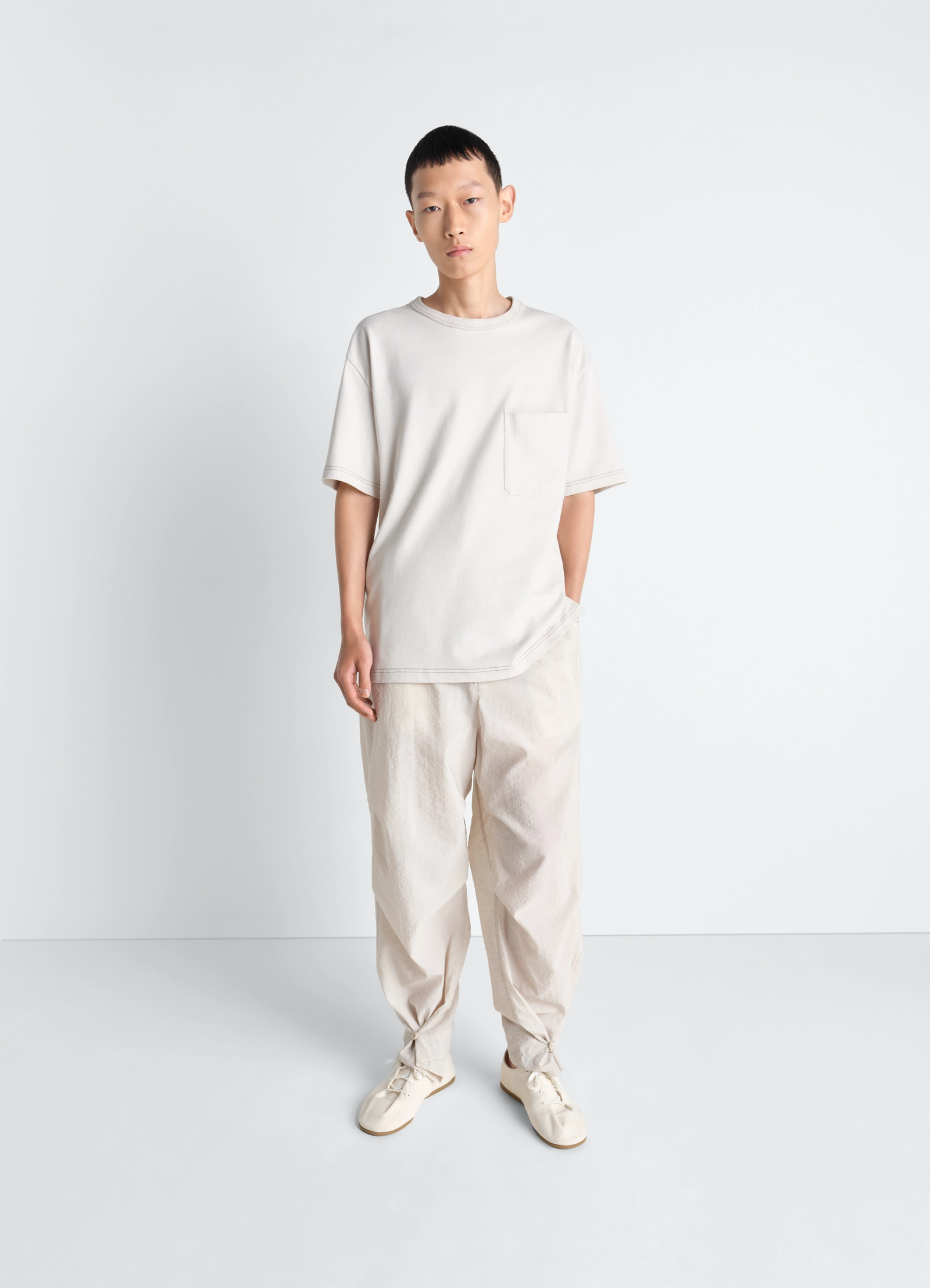 Lemaire boxy short sleeve t-shirt in linen cotton jersey, model shot, three-quarter view relaxed fit